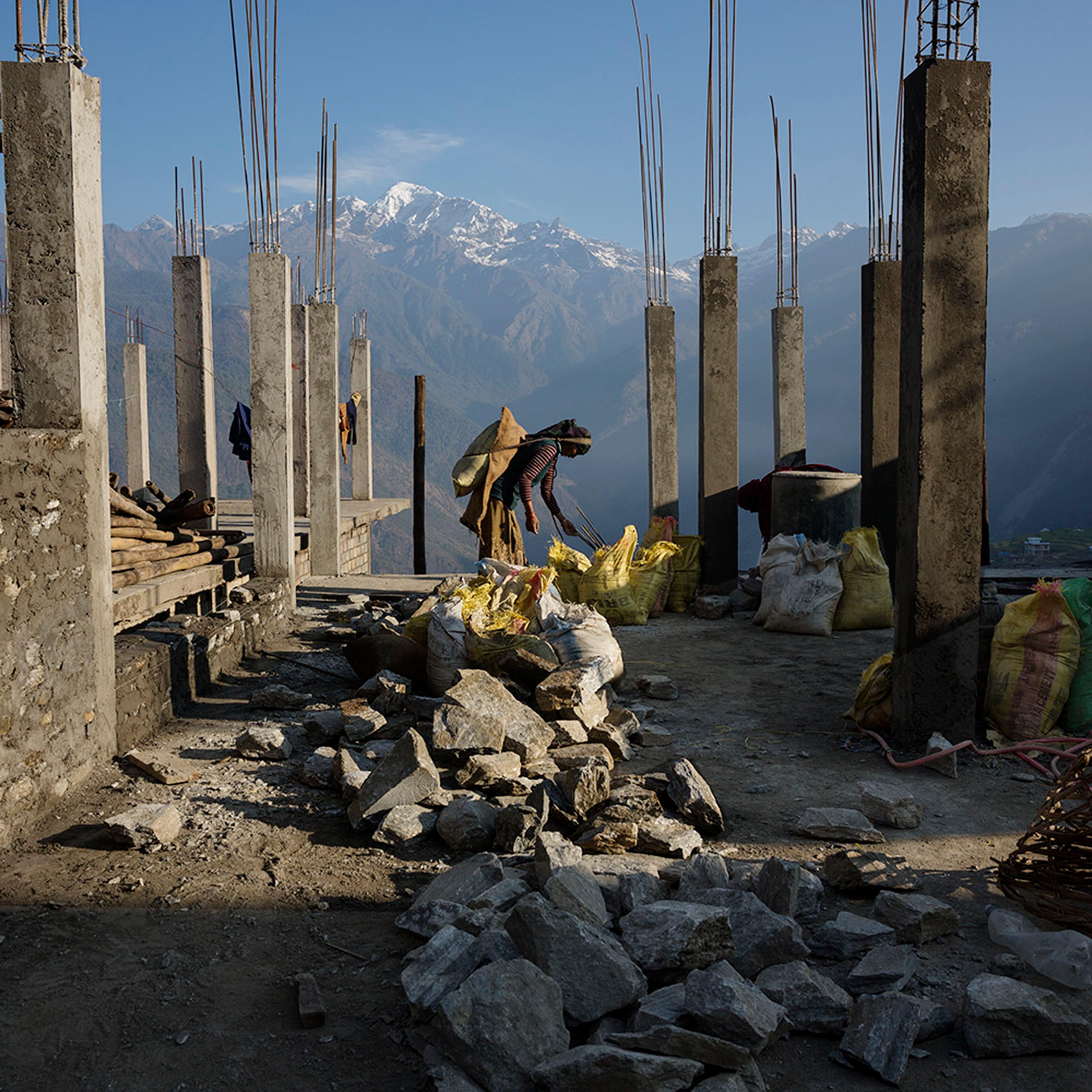 Villagers rebuild houses and pathways in the village of Barpak, in Gorkha district, Nepal, at the epicenter of the April and May 2015 earthquakes which killed 9000 people, April 6, 2016.