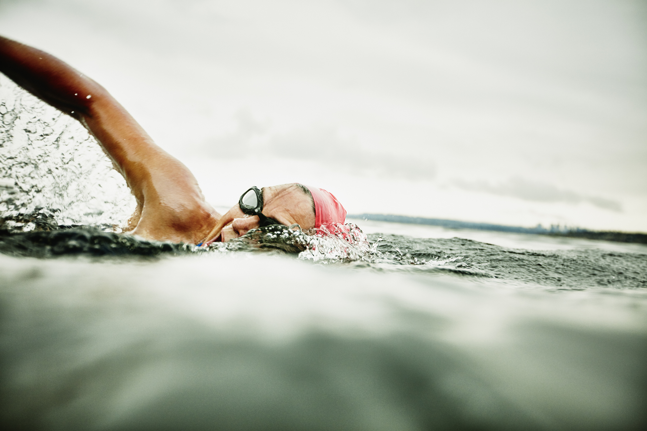 Woman taking a breath during open water swim
