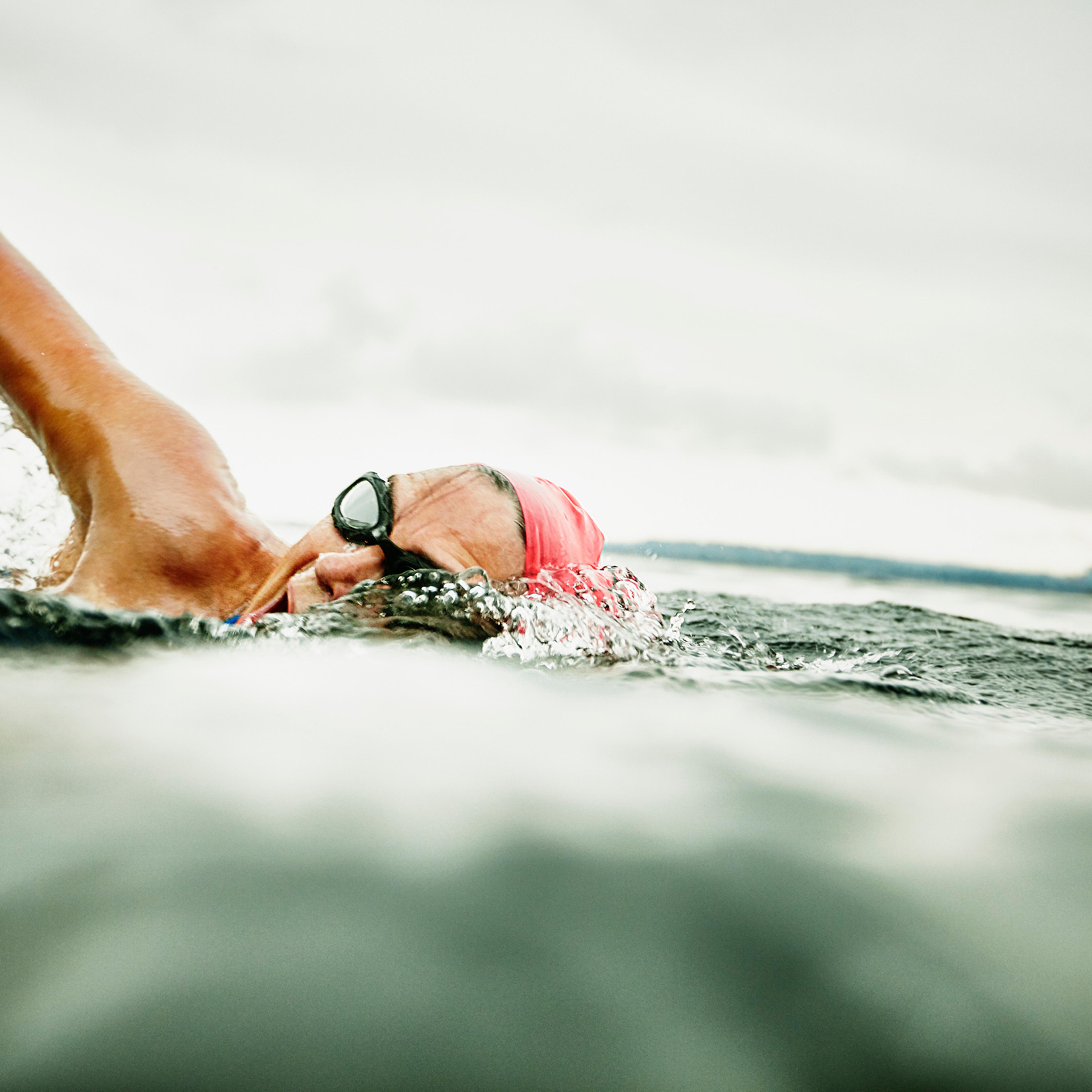 Woman taking a breath during open water swim