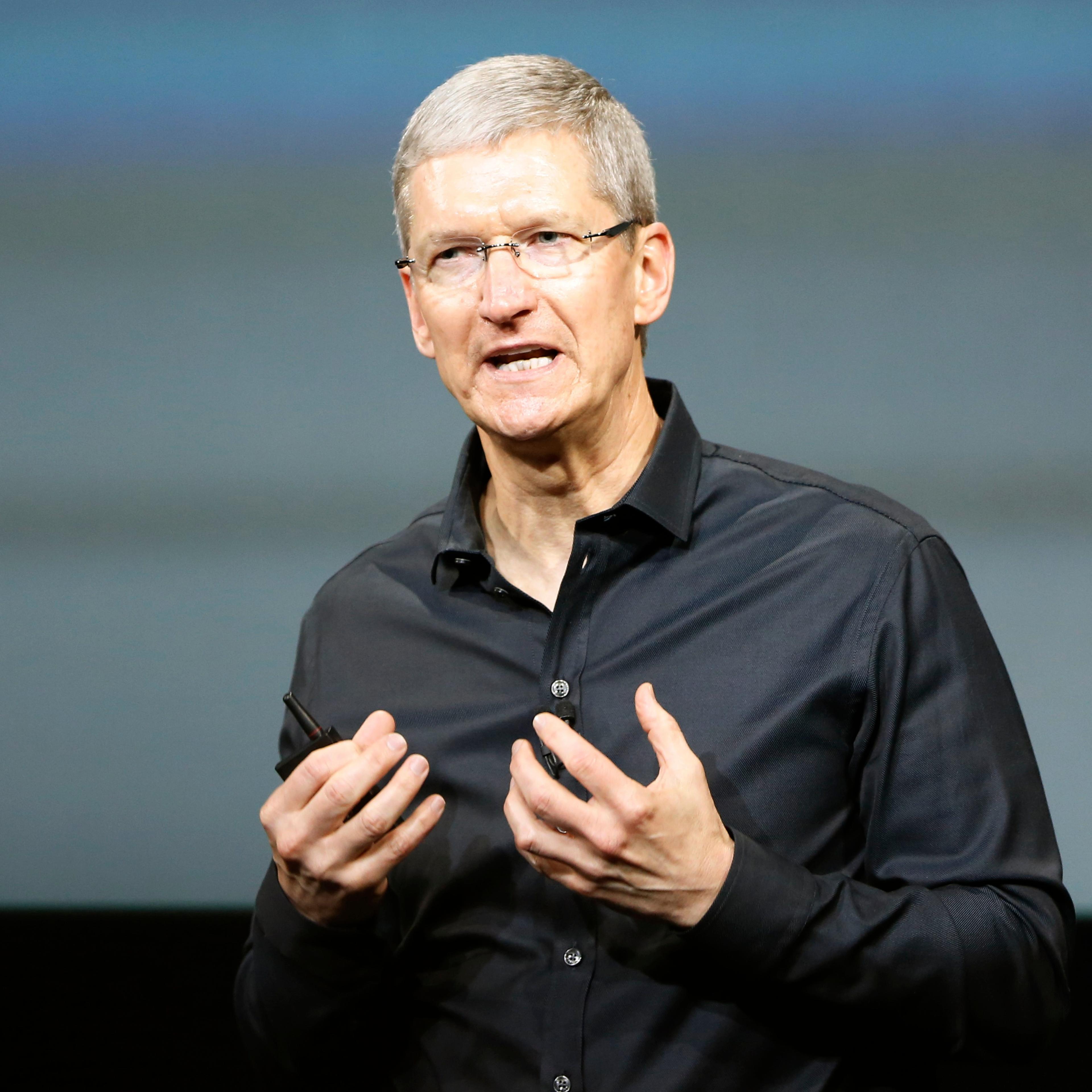 Apple Inc CEO Tim Cook speaks from the stage during Apple Inc's media event in Cupertino