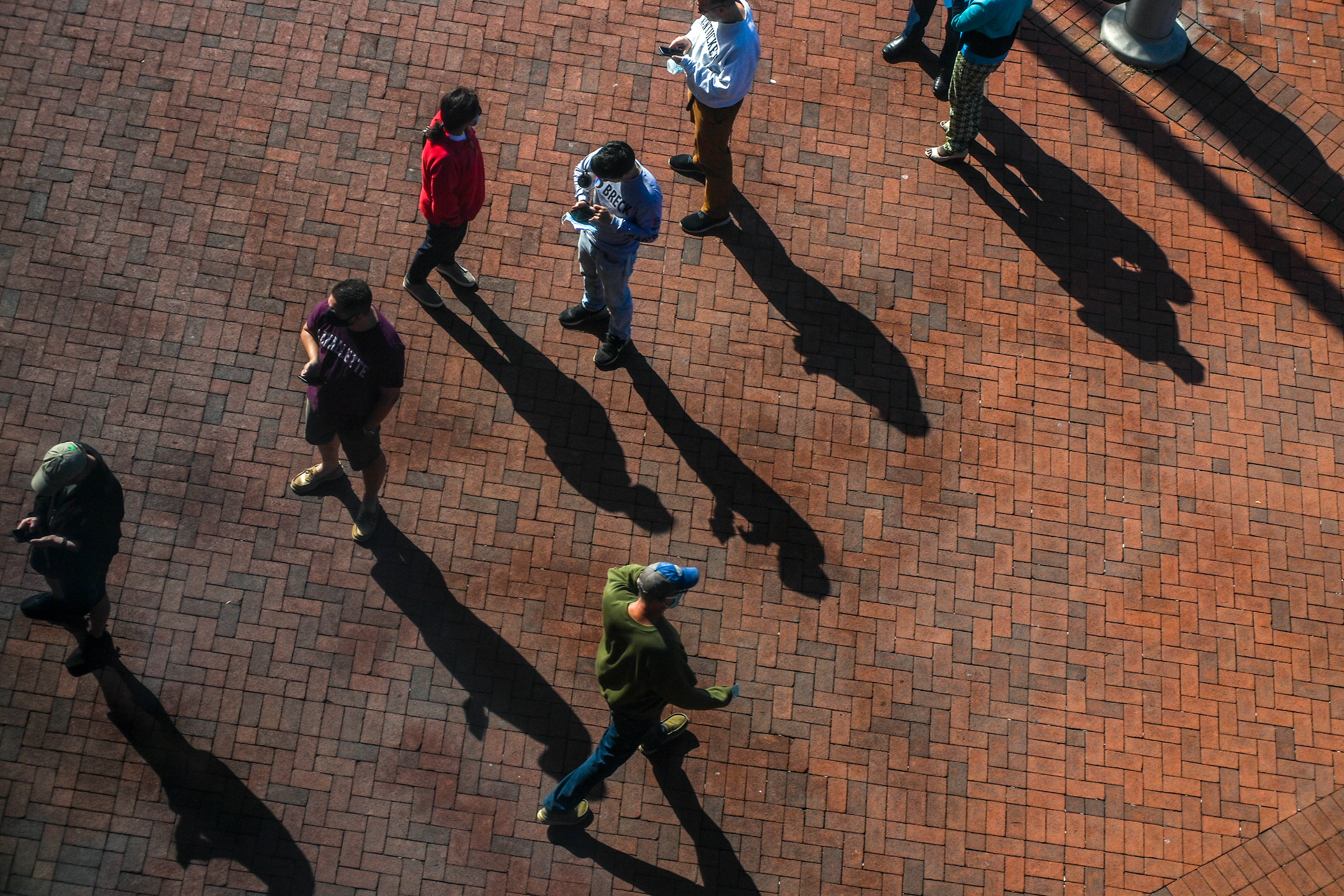 Voters wait in line outside a polling place in Fairfax, Va., on Oct. 23.
