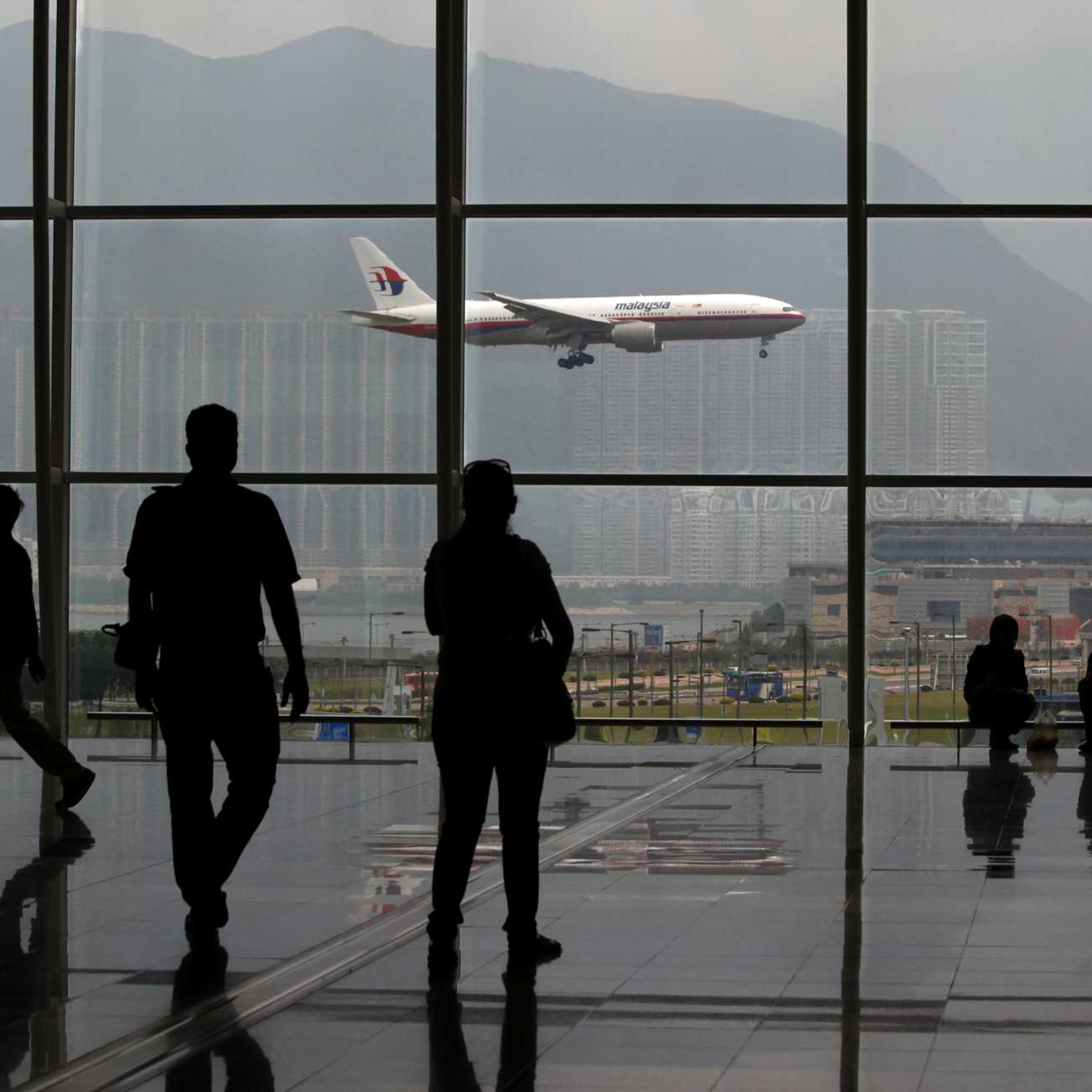 A Malaysia Airlines Boeing 777 plane is seen from the departure hall at the Hong Kong International Airport in a file photo taken in June 2011