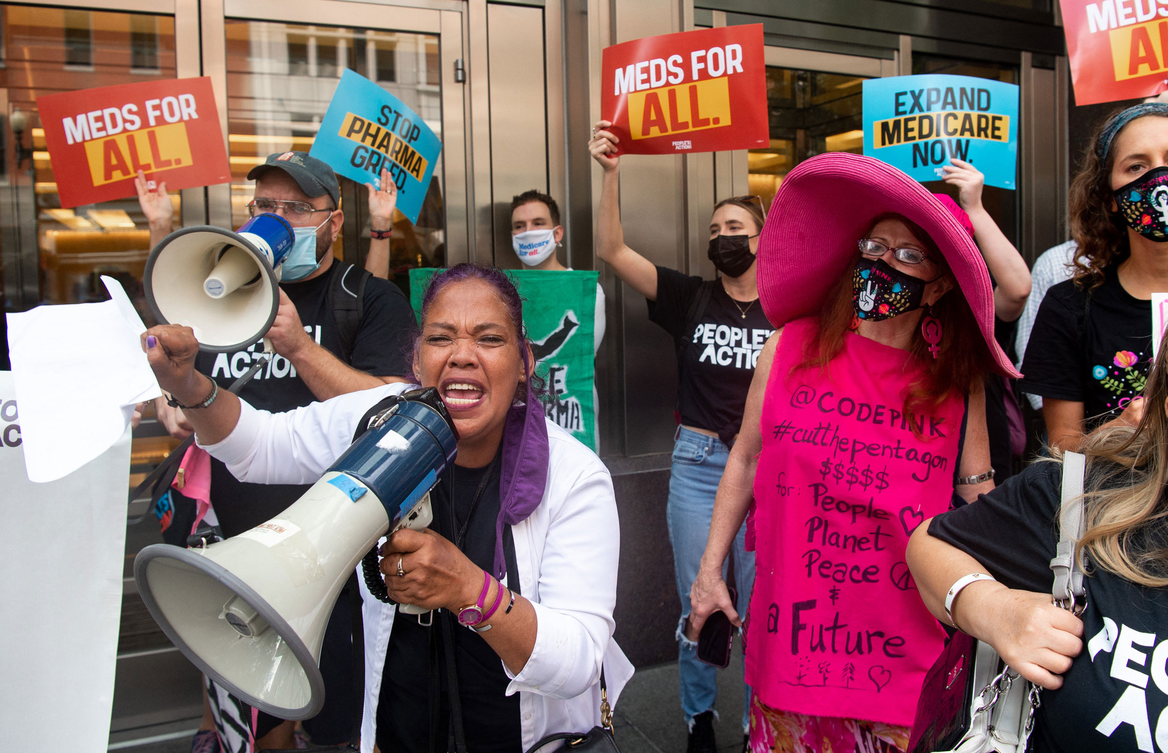 Demonstrators from the People's Action protest pharmaceutical companies' lobbying against allowing Medicare to negotiate lower prescription drug prices