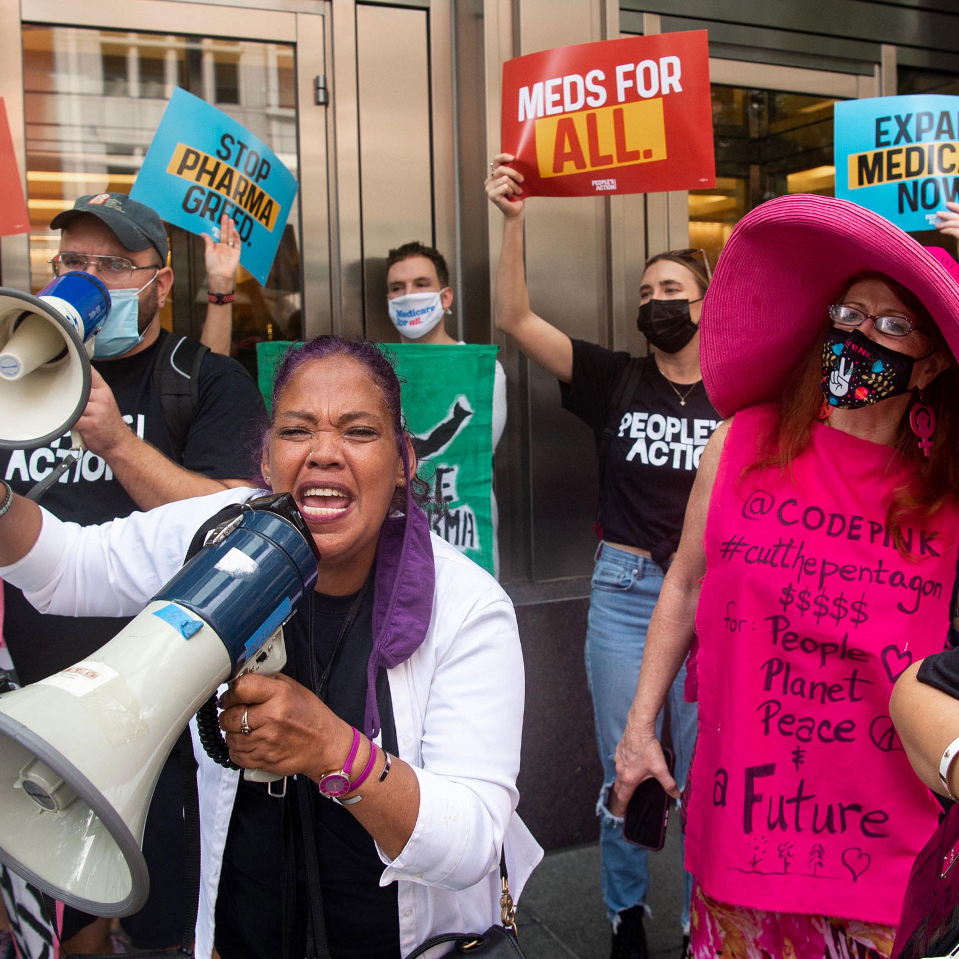 Demonstrators from the People's Action protest pharmaceutical companies' lobbying against allowing Medicare to negotiate lower prescription drug prices