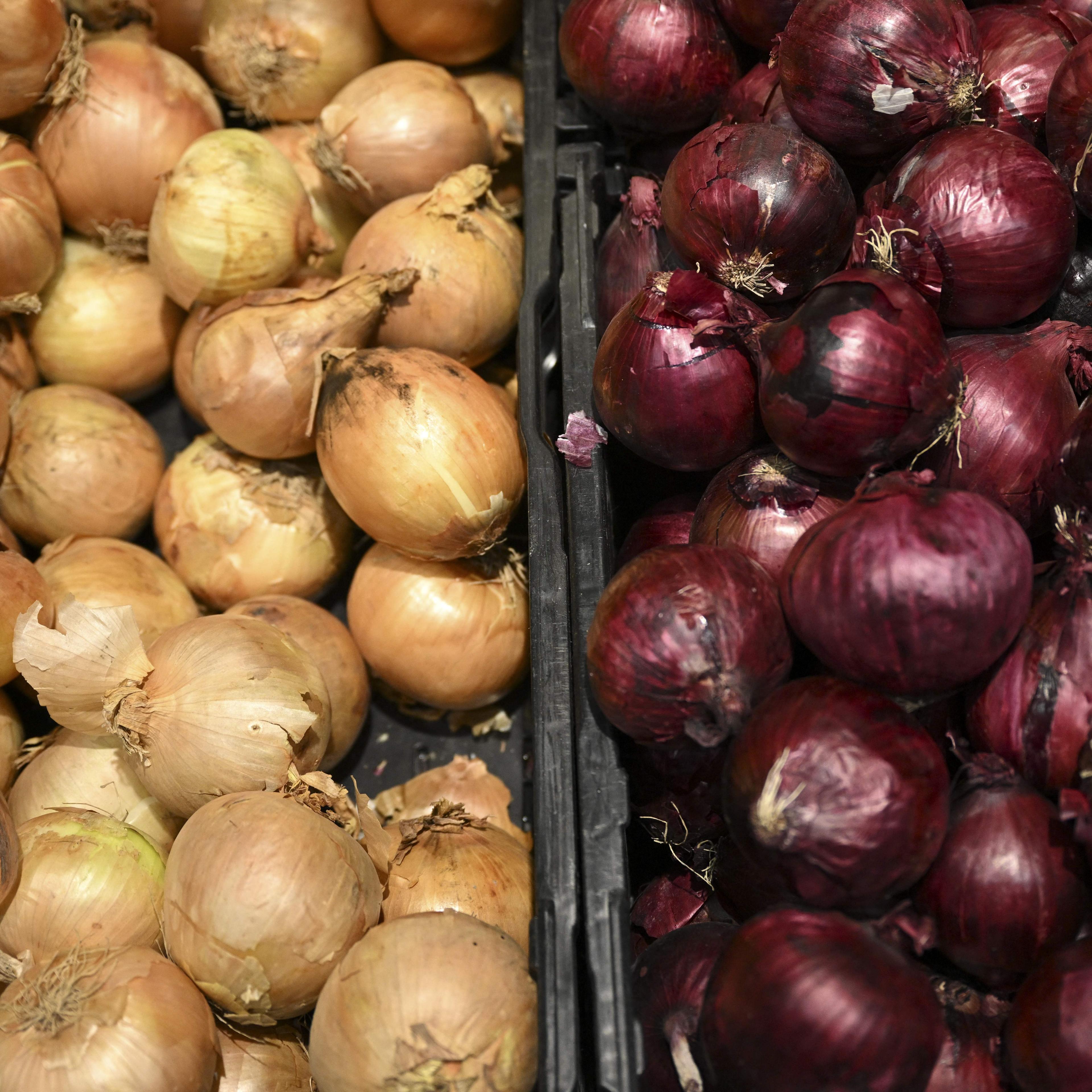 Onions displayed in a supermarket.
