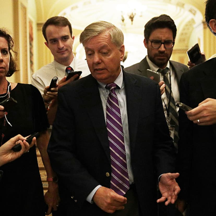 U.S. Sen. Lindsey Graham (R-SC) (C) speaks to members of the media after the weekly Senate Republican policy luncheon at the Capitol September 19, 2017 in Washington, DC.