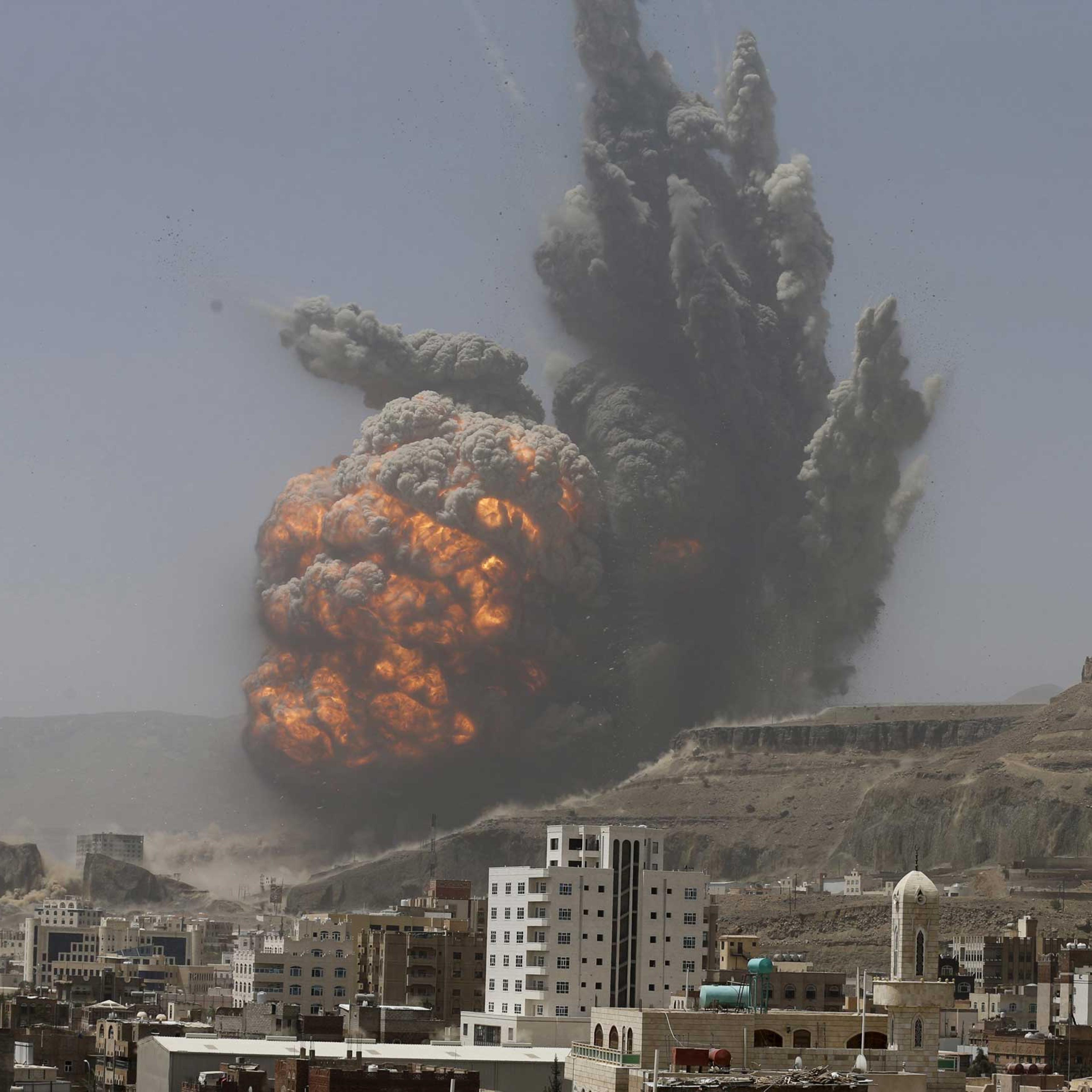 Smoke rises during an air strike on an army weapons depot on a mountain overlooking Yemen's capital Sanaa April 20, 2015.