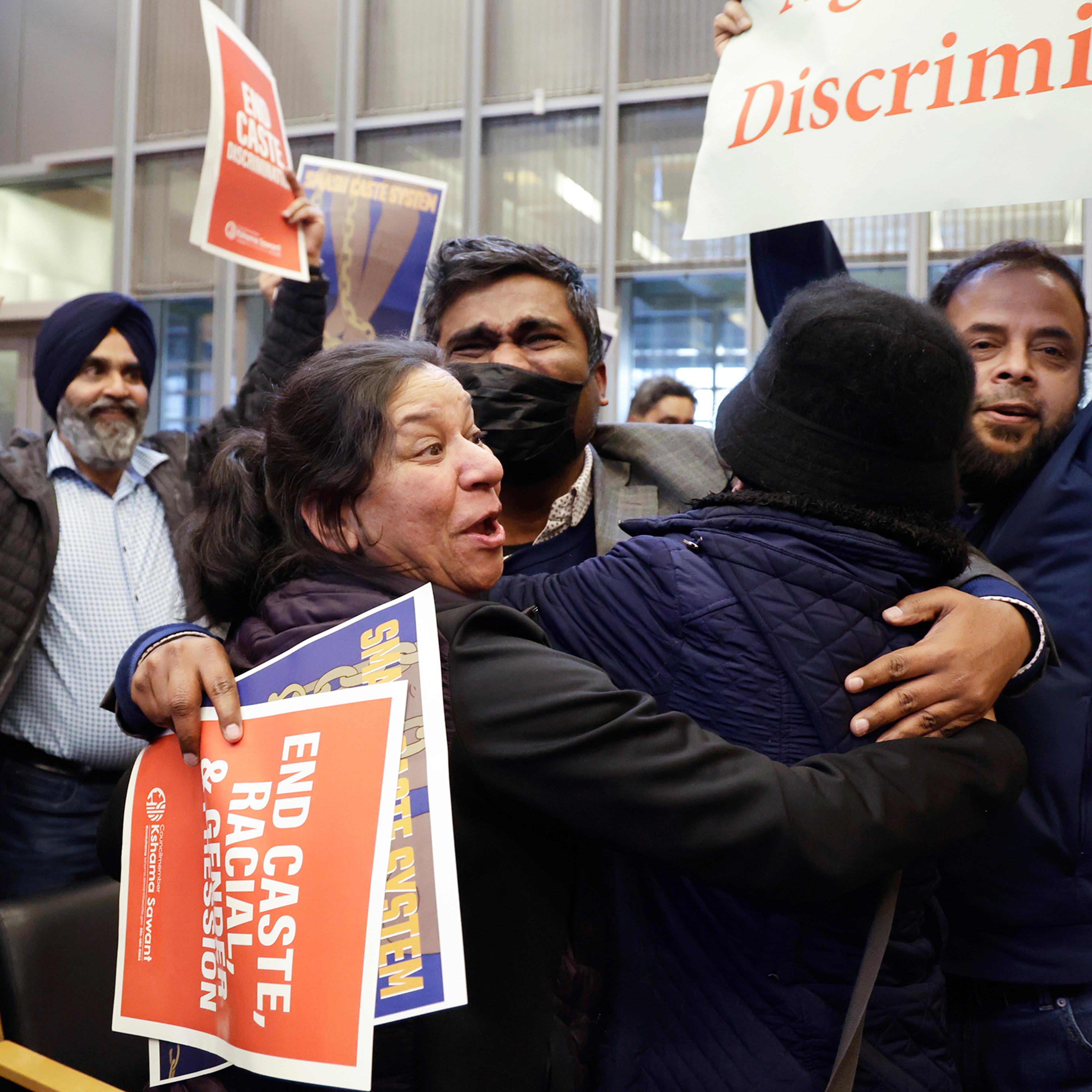 People celebrate the passing of an ordinance to add caste to Seattle's anti-discrimination laws in the Seattle City Council chambers on Feb. 21.