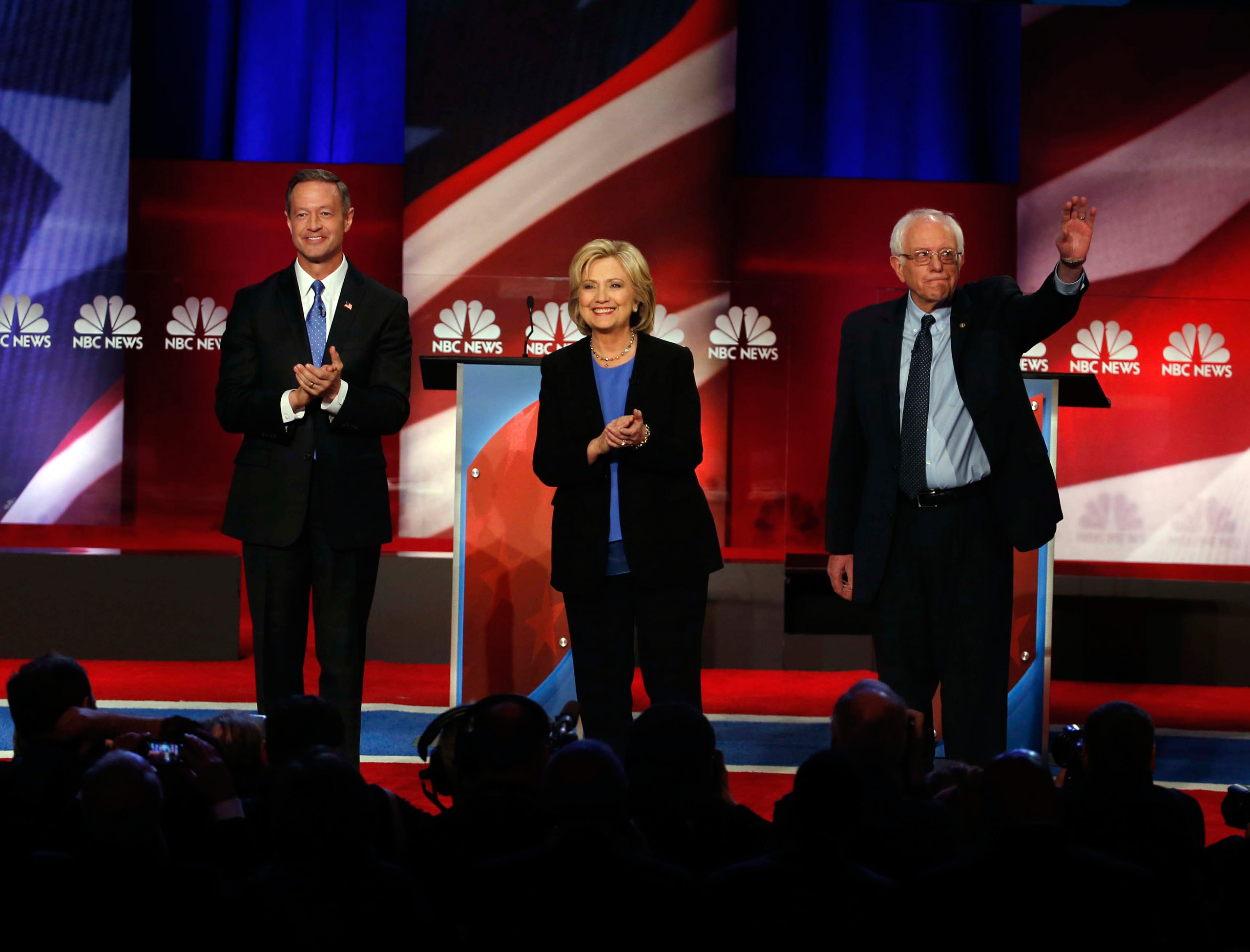 Democratic presidential candidate, former Maryland Gov. Martin O'Malley , left, Democratic presidential candidate, Hillary Clinton and Democratic presidential candidate, Sen. Bernie Sanders, I-Vt, stand together before the start of the NBC, YouTube Democ