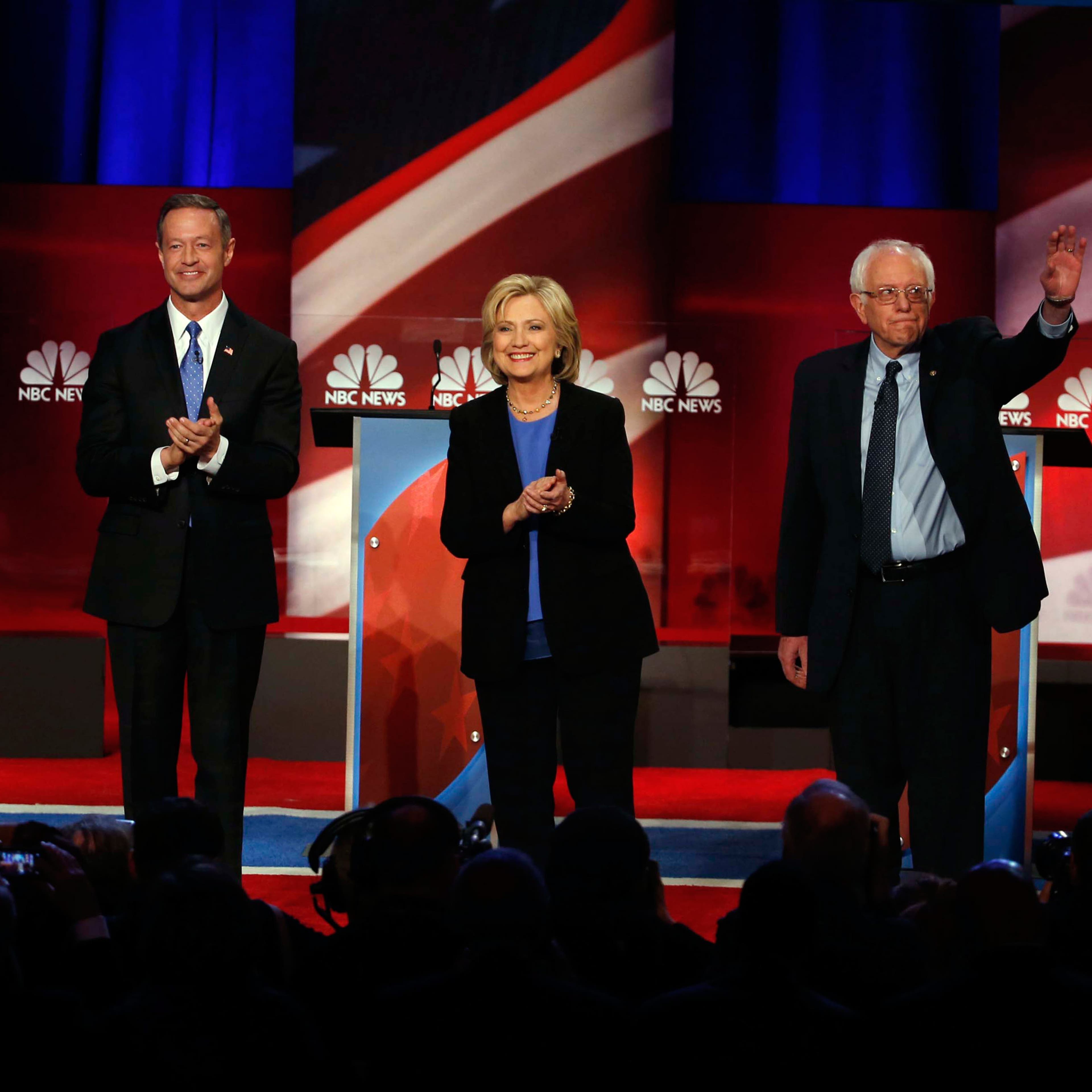Democratic presidential candidate, former Maryland Gov. Martin O'Malley , left, Democratic presidential candidate, Hillary Clinton and Democratic presidential candidate, Sen. Bernie Sanders, I-Vt, stand together before the start of the NBC, YouTube Democ