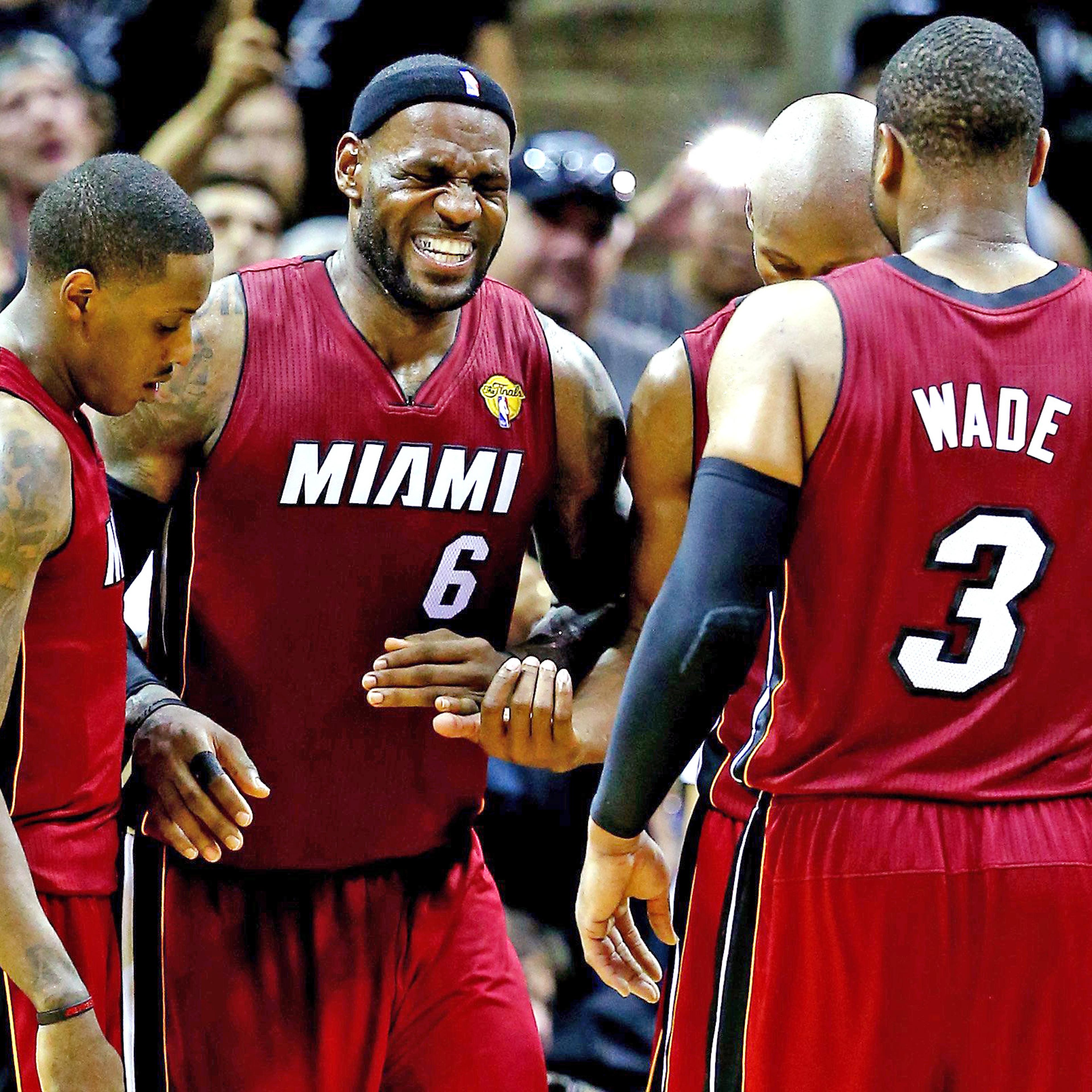LeBron James #6 of the Miami Heat reacts after cramping up against the San Antonio Spurs during Game One of the 2014 NBA Finals at the AT&T Center on June 5, 2014 in San Antonio.
