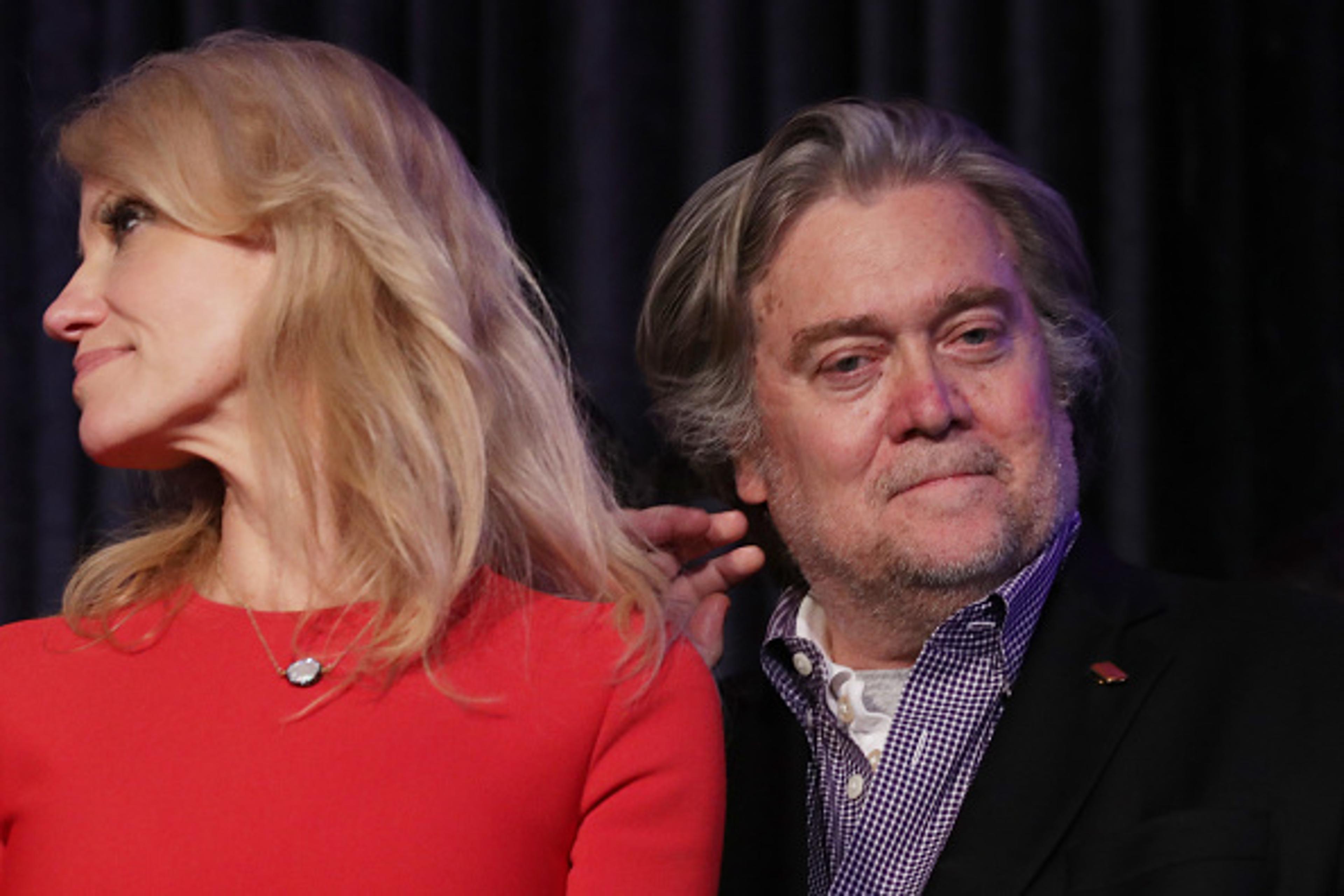 Republican president-elect Donald Trump's campaign manager, Kellyanne Conway, and Trump campaign CEO Stephen Bannon stand on stage during the election night event at the New York Hilton Midtown in the early morning hours of November 9, 2016 in New York C