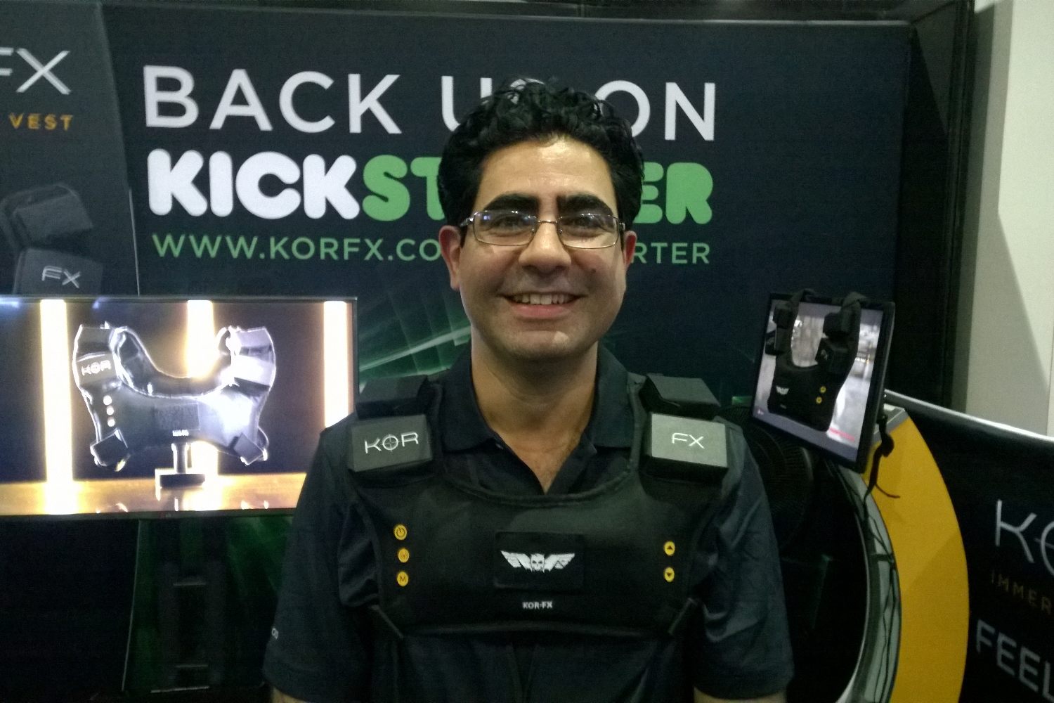 Shahriar Afshar, President and Founder of Immerz, wears the KOR-FX haptic gaming vest at E3 2014.