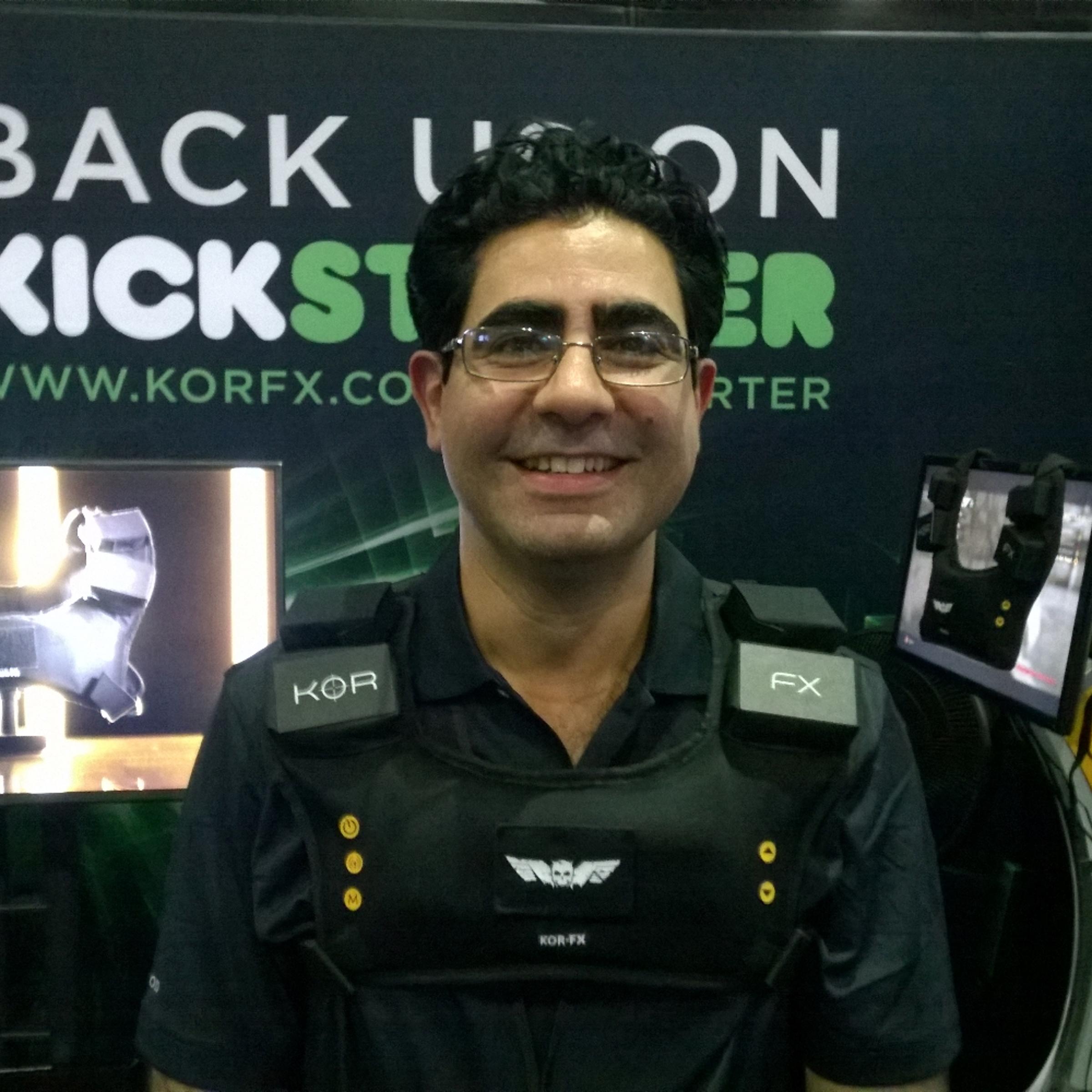 Shahriar Afshar, President and Founder of Immerz, wears the KOR-FX haptic gaming vest at E3 2014.