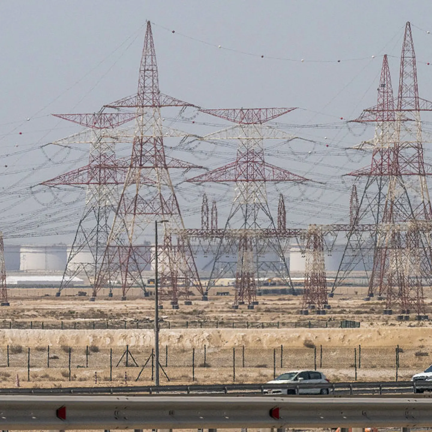 Motorists drive past an ADNOC Gas facility, a subsidiary of the Abu Dhabi National Oil Company, in Abu Dhabi on March 3, 2026. The war launched by the United States and Israel against Iran spread across the Middle East, threatening to plunge the global economy into chaos, with Lebanon and Gulf energy exporters dragged into the conflict.
