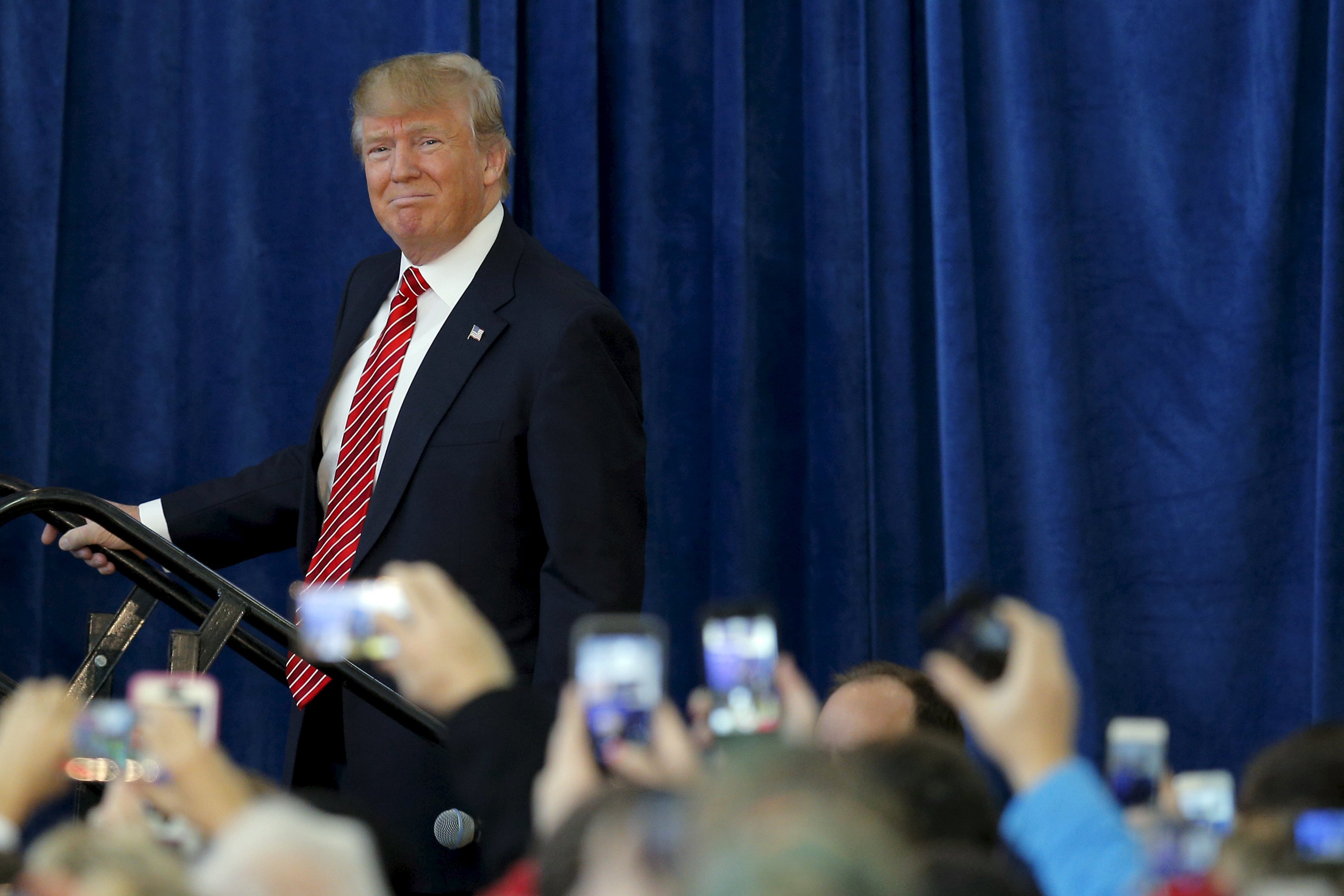 U.S. Republican presidential candidate Donald Trump takes the stage at a campaign rally in Portsmouth