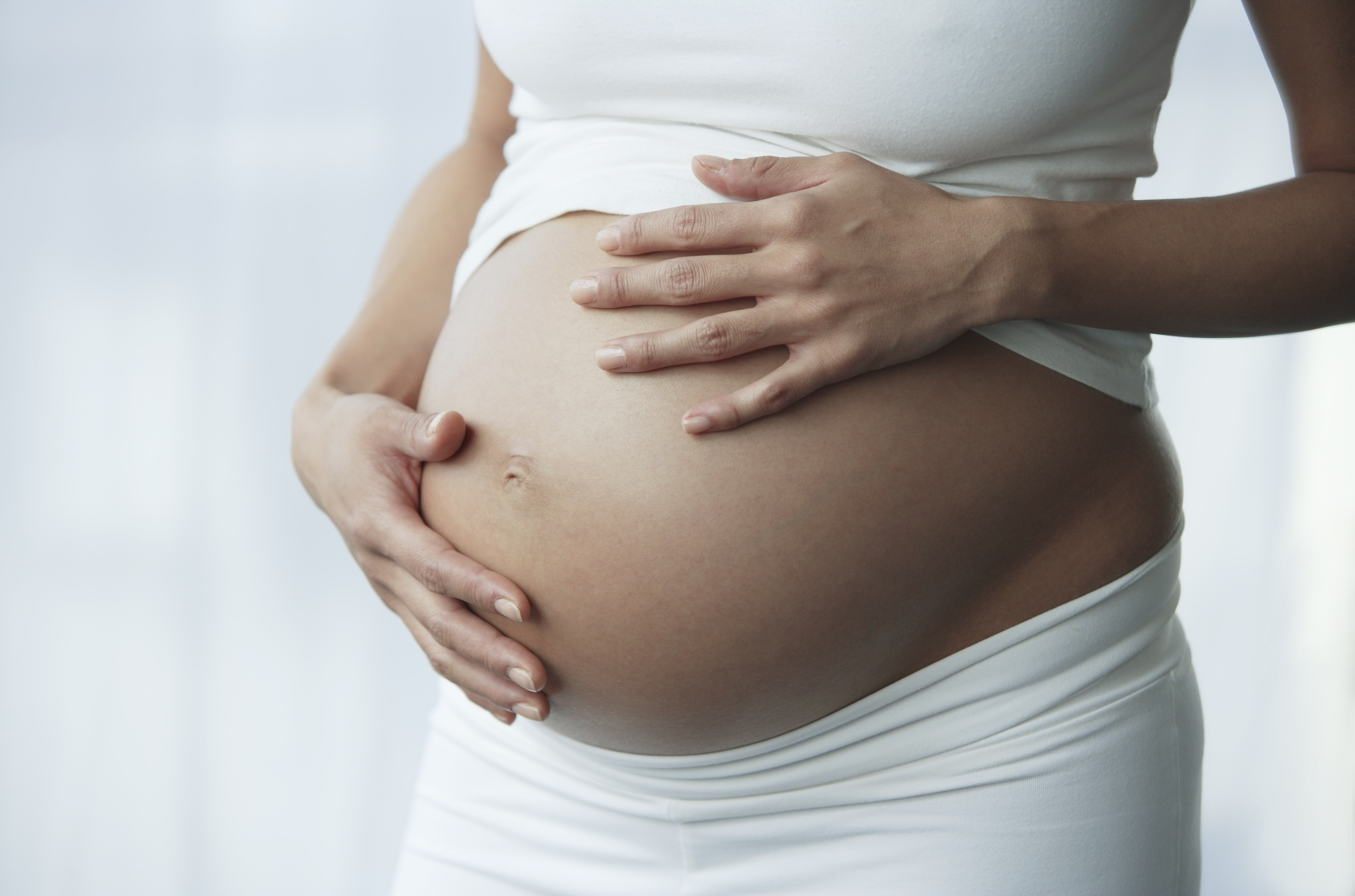 hands on pregnant stomach