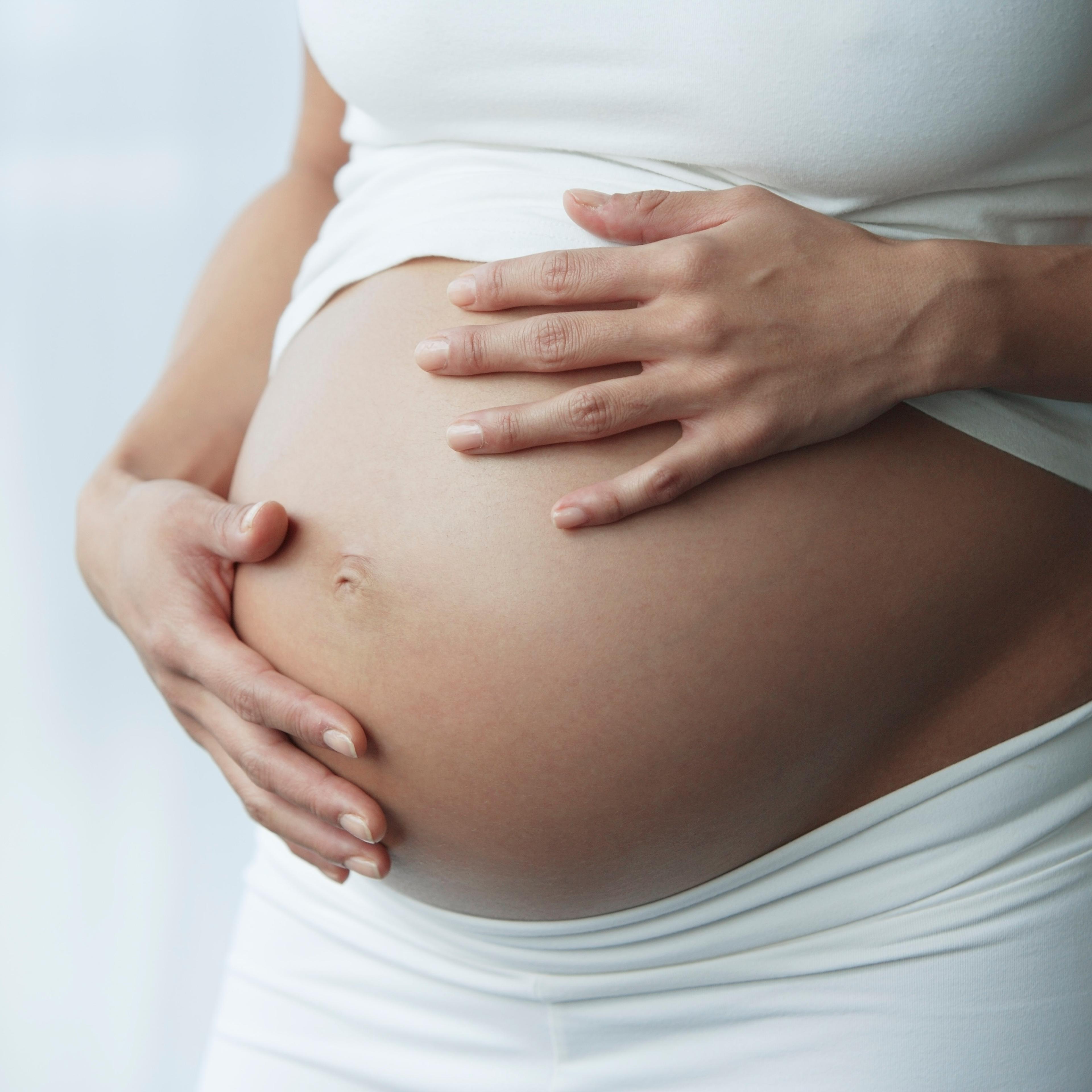 hands on pregnant stomach