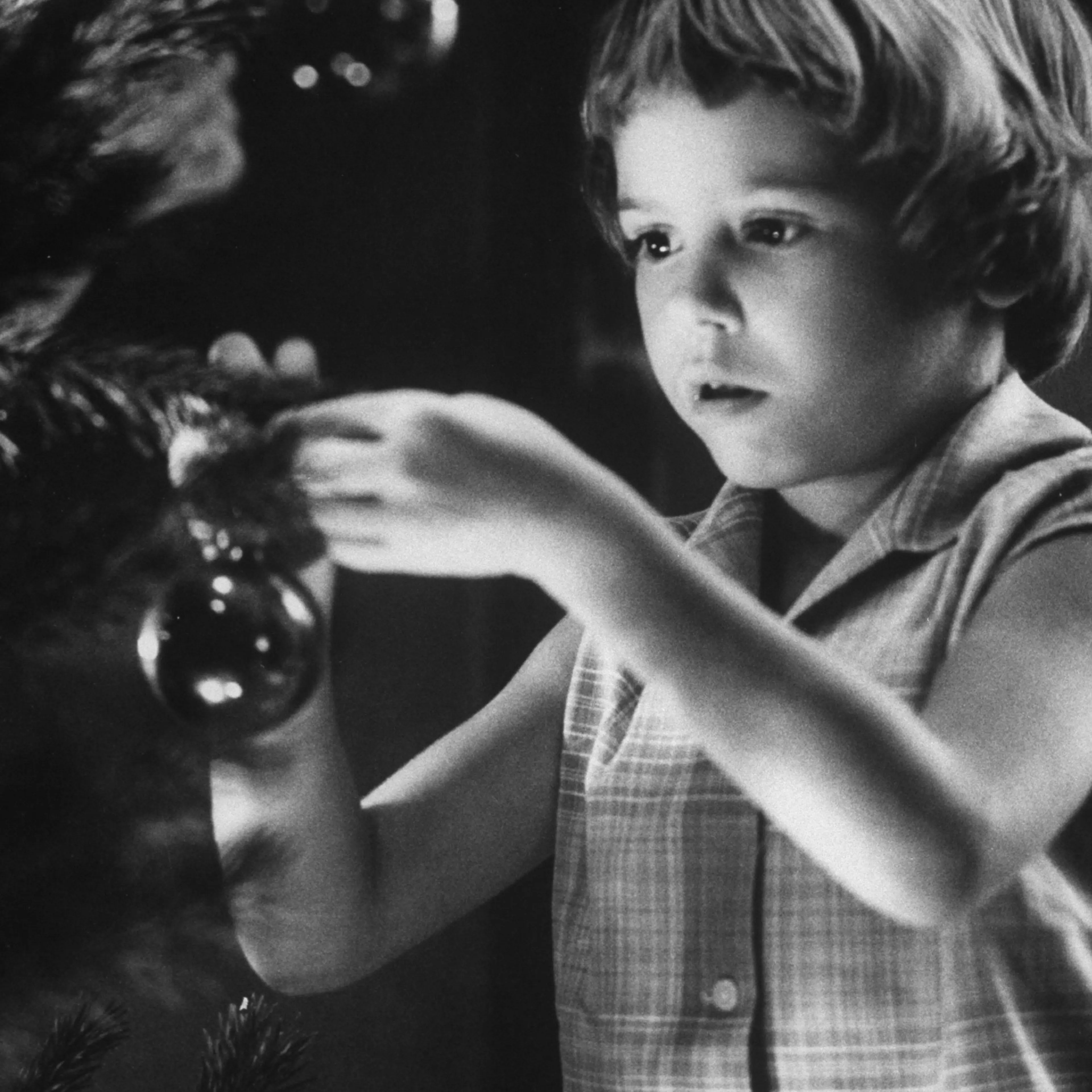 Tina Smith decorating a Christmas tree at Guantanamo Naval Base, where her dad, Lt. Commander Joe Smith is stationed, 1962.