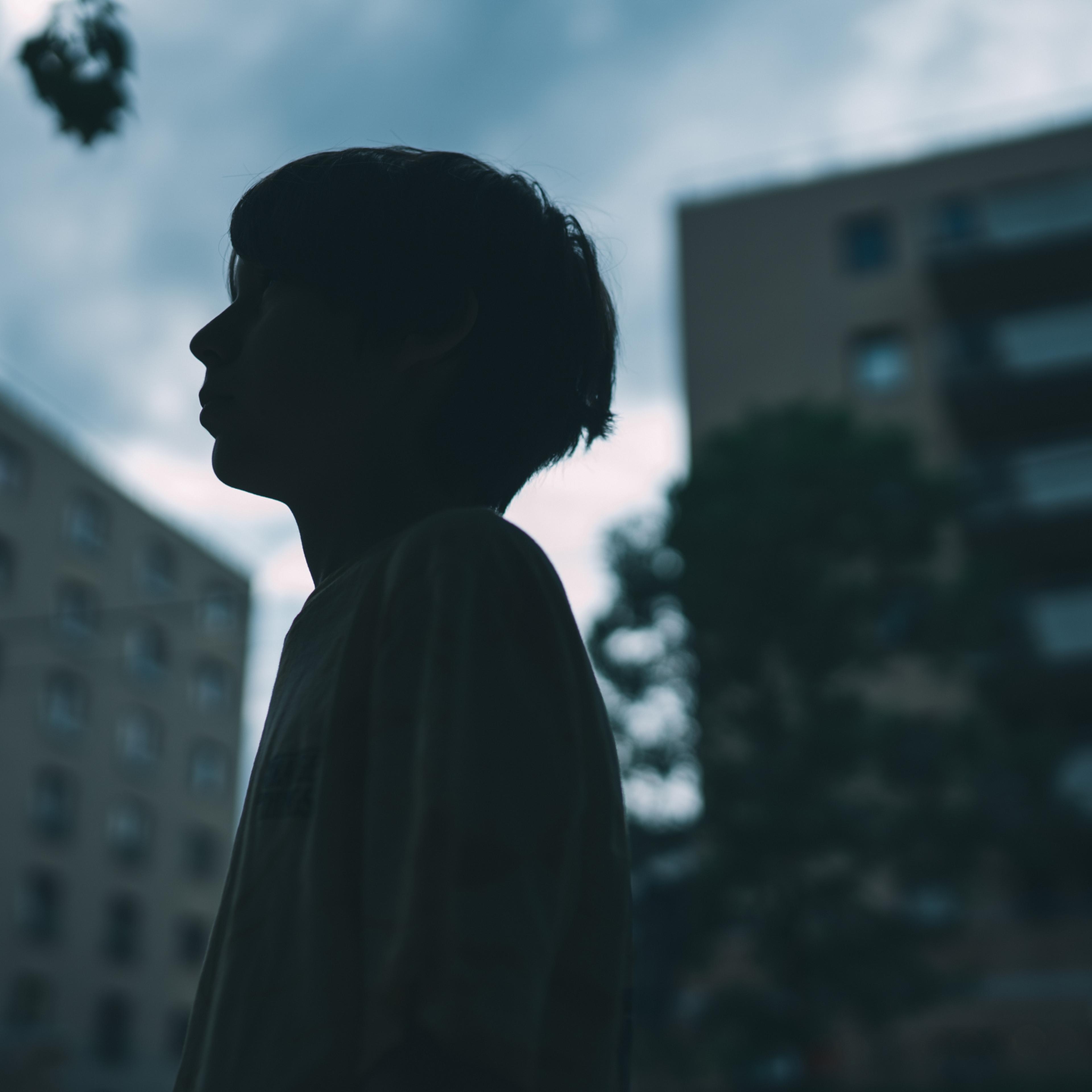 Silhouette of a teenager on the street