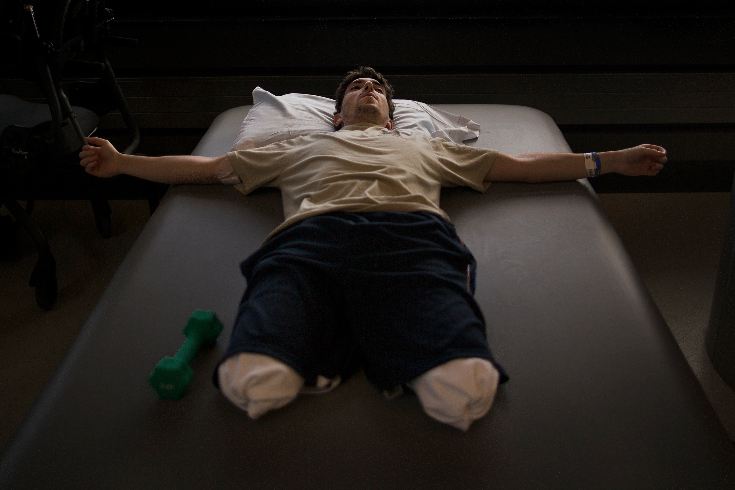Jeff Bauman, who lost his lower legs in the Boston Marathon bombings, rests between occupational therapy sessions at Spaulding Rehabilitation Hospital in Boston, May 8, 2013.