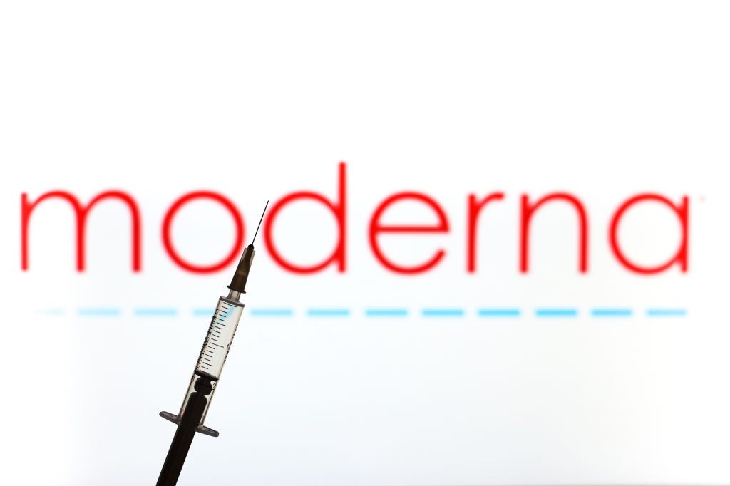 In this photo illustration a medical syringe is seen in