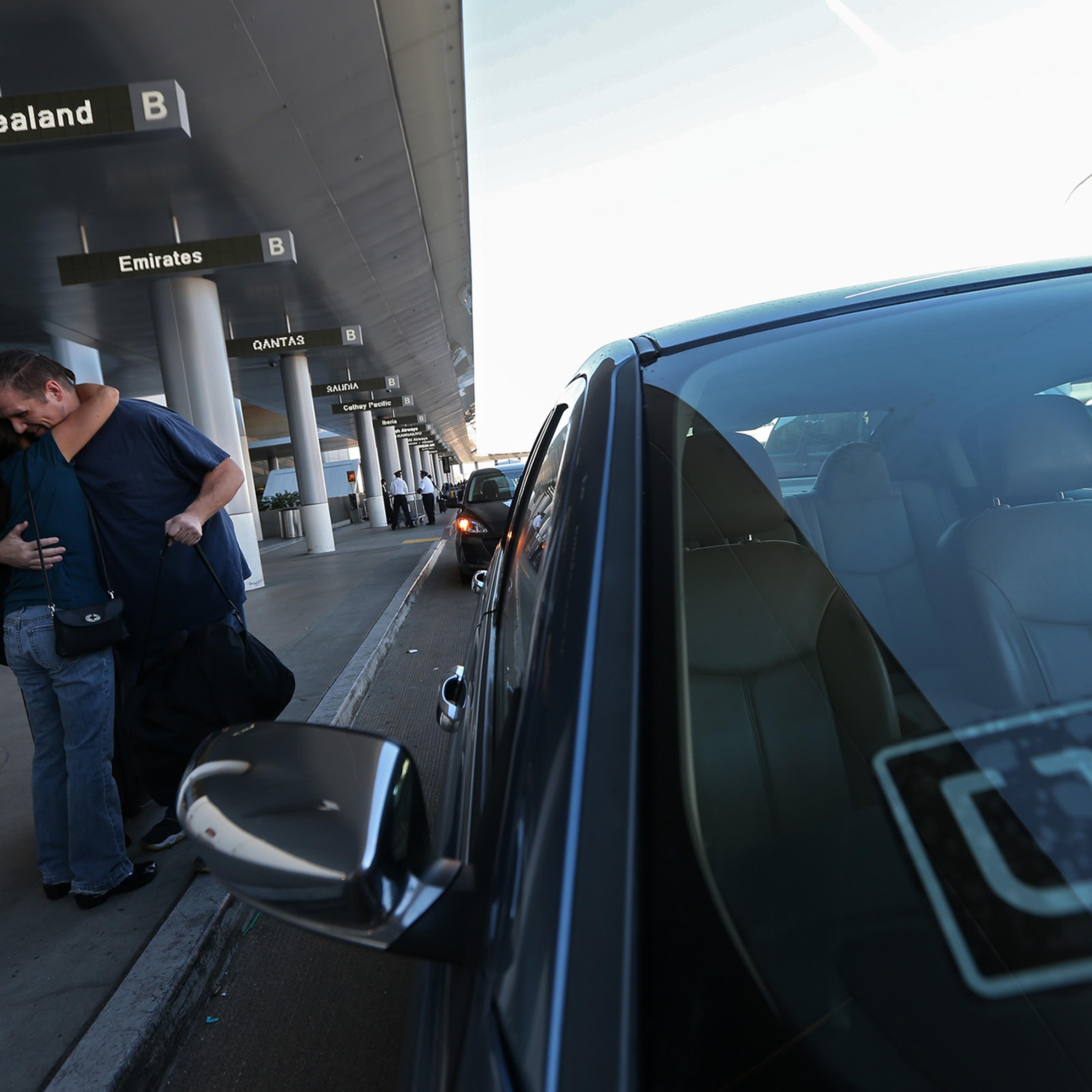 An Uber driver drops off a passenger at LAX, October 20, 2015.