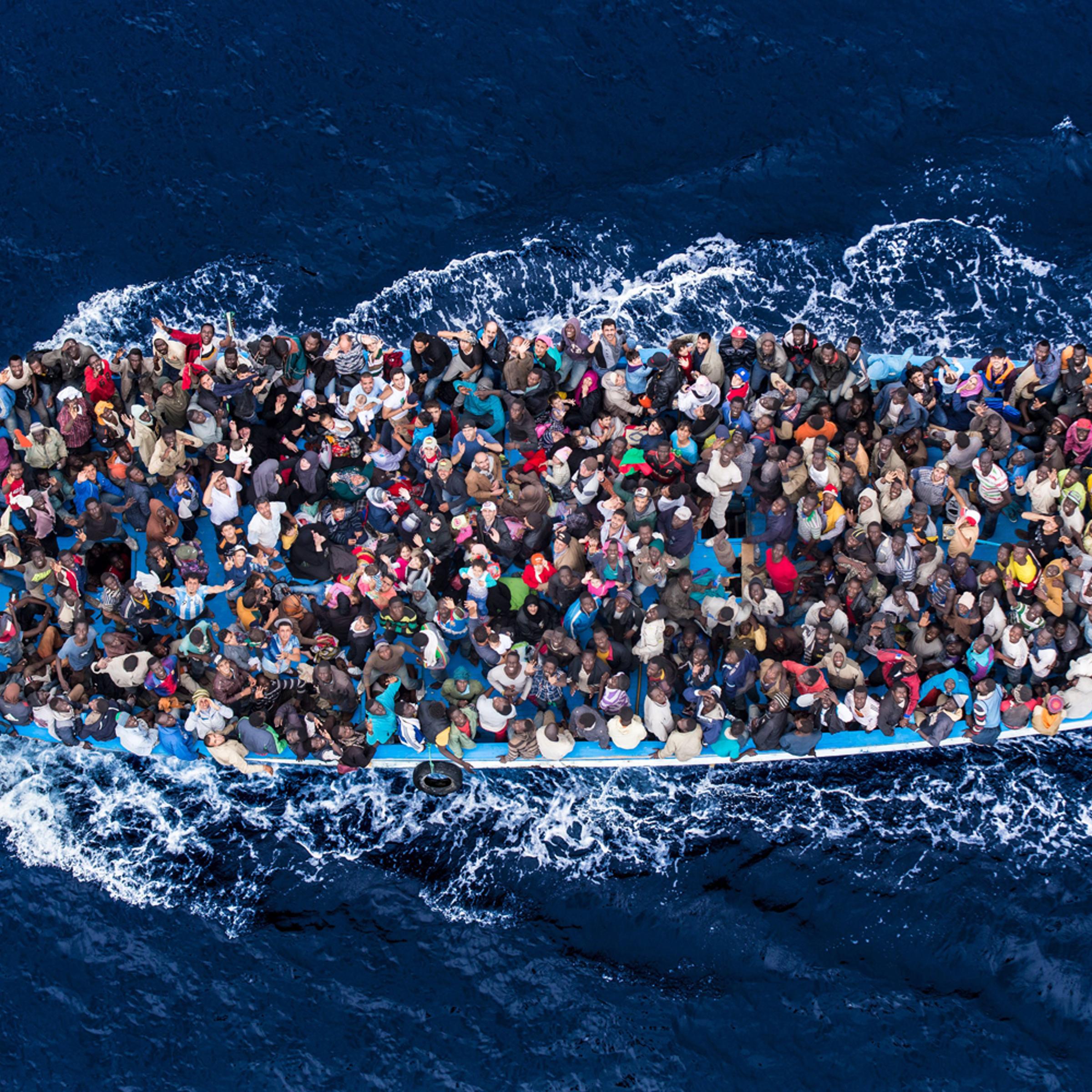 Italian navy rescues asylum seekers traveling by boat off the coast of Africa in the Mediterranean Sea, June 7, 2014.