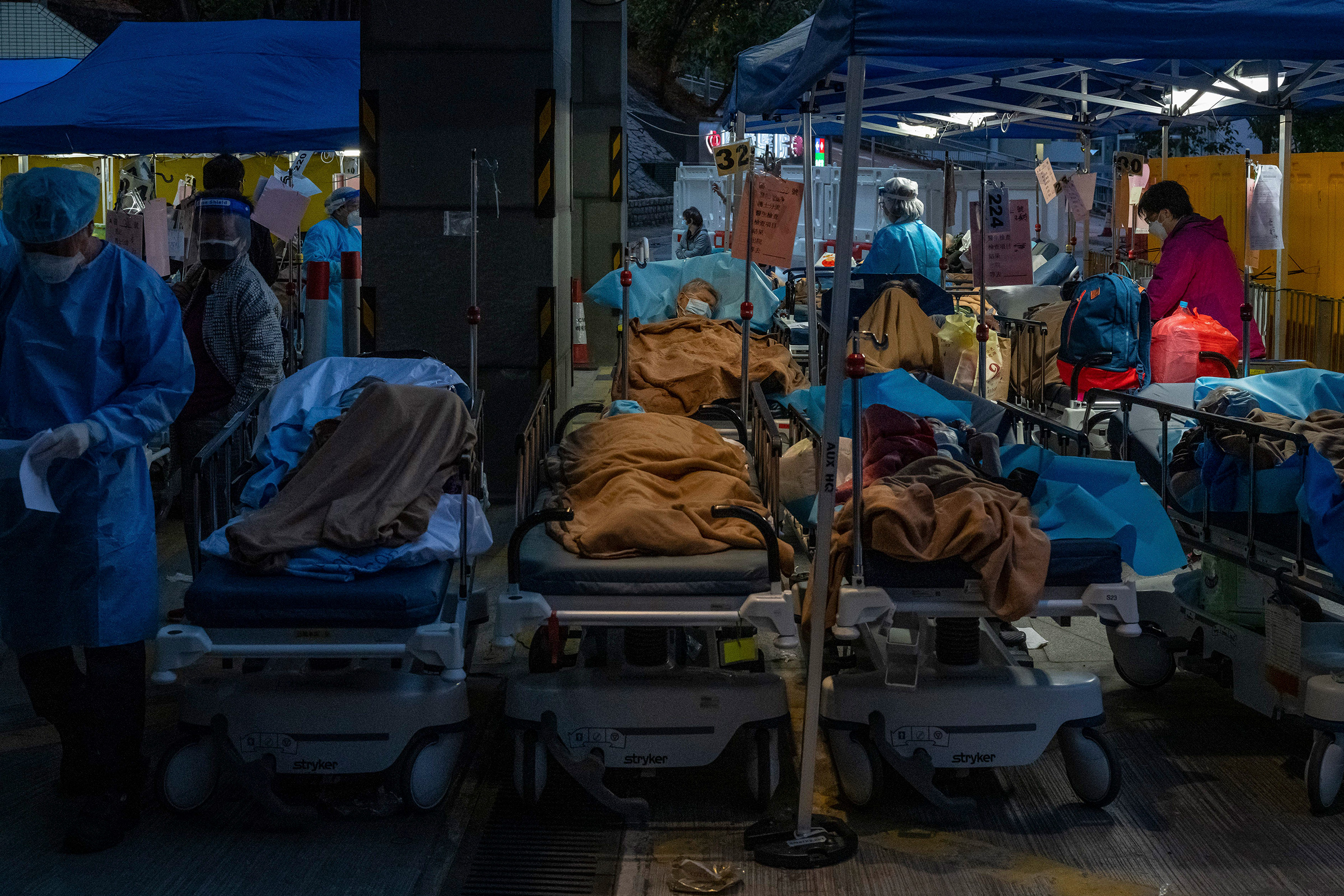 Patients are treated at a makeshift area outside Caritas Medical Center in Hong Kong, March 2