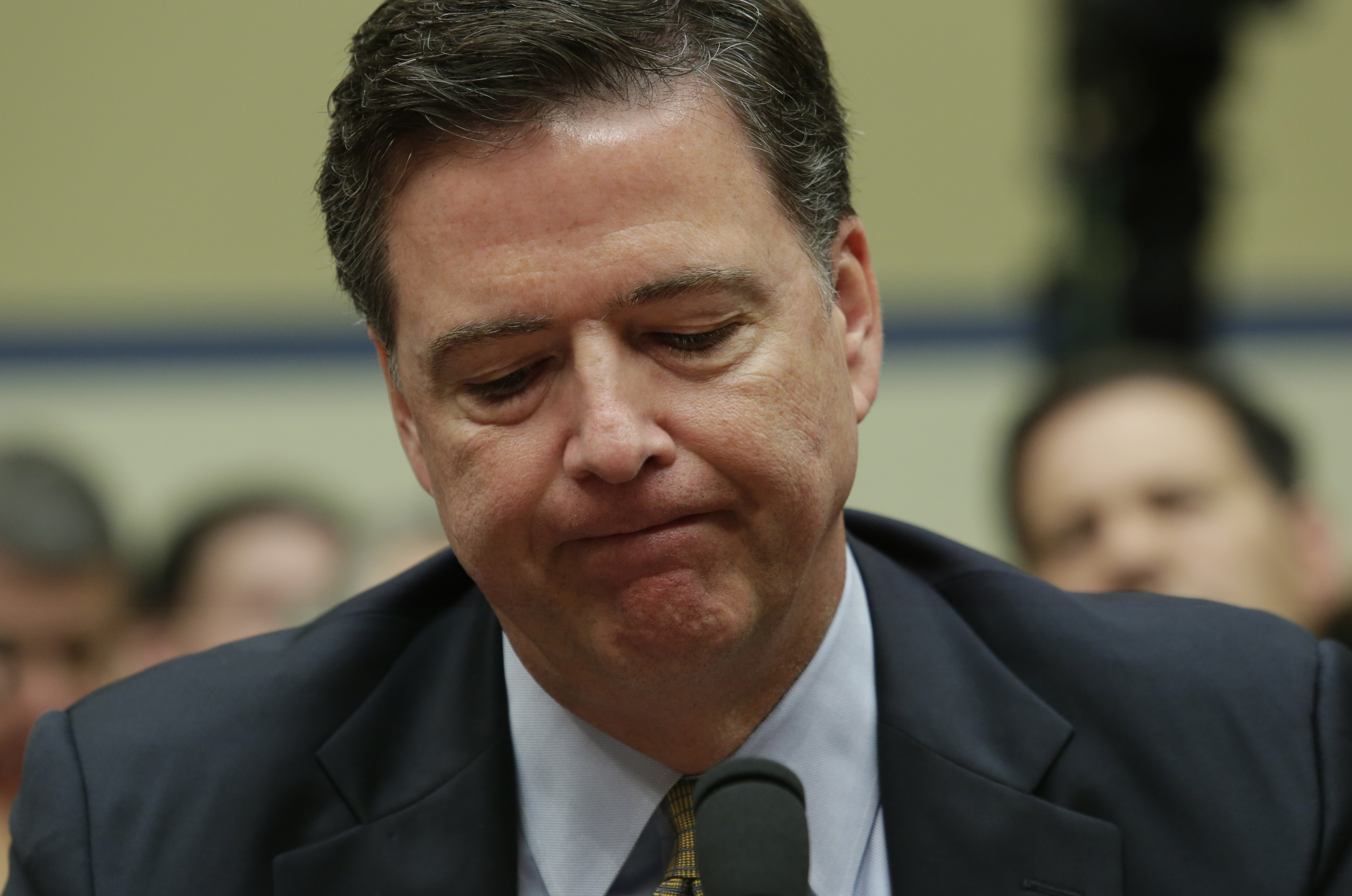 FBI Director James Comey testifies before a House Oversight and Government Reform Committee hearing on Capitol Hill in Washington, DC, on July 7, 2016.