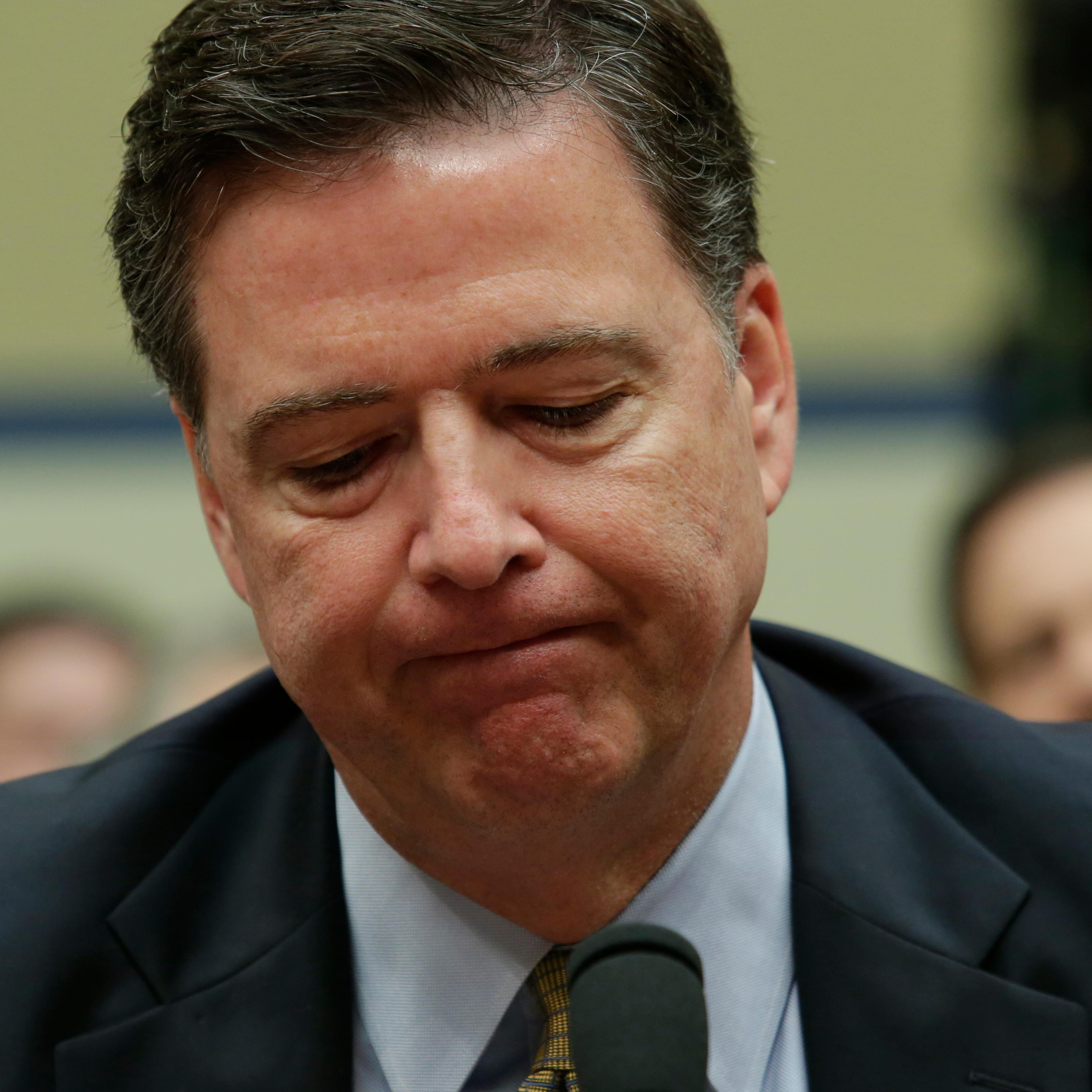 FBI Director James Comey testifies before a House Oversight and Government Reform Committee hearing on Capitol Hill in Washington, DC, on July 7, 2016.