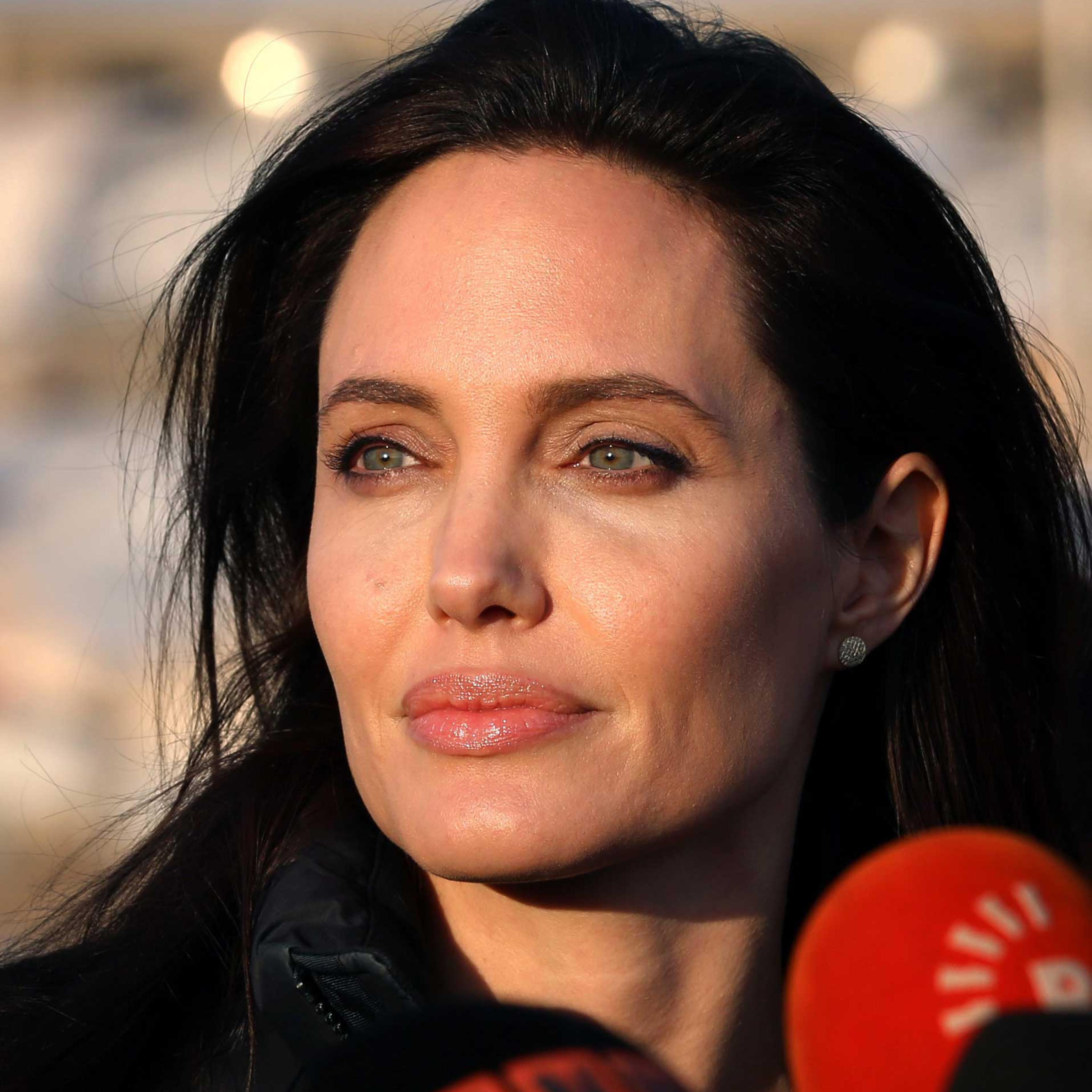 US actress and UNHCR ambassador Angelina Jolie pauses as she delivers a speech during a visit to a camp for displaced Iraqis in Khanke, a few kilometres (miles) from the Turkish border in Iraq's Dohuk province, on Jan. 25, 2015.