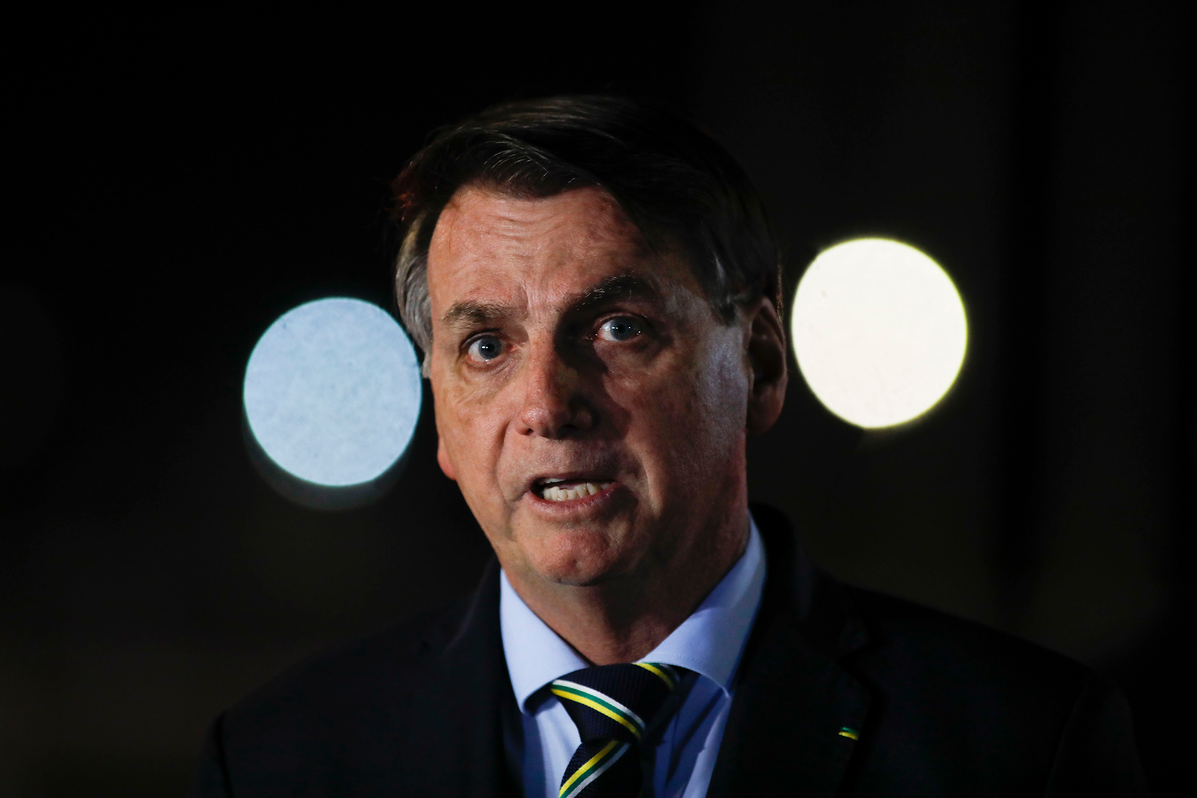 Brazil's President Jair Bolsonaro delivers a  press conference at Palacio da Alvorada da presidencial residence on April 16