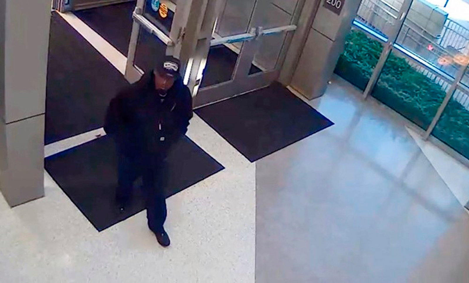 A man identified by the San Antonio Police Department as a suspect in the shooting death of police detective Benjamin Marconi, 50, is seen entering the police headquarters building in San Antonio, Texas, November 20, 2016, in a frame grab from video rele