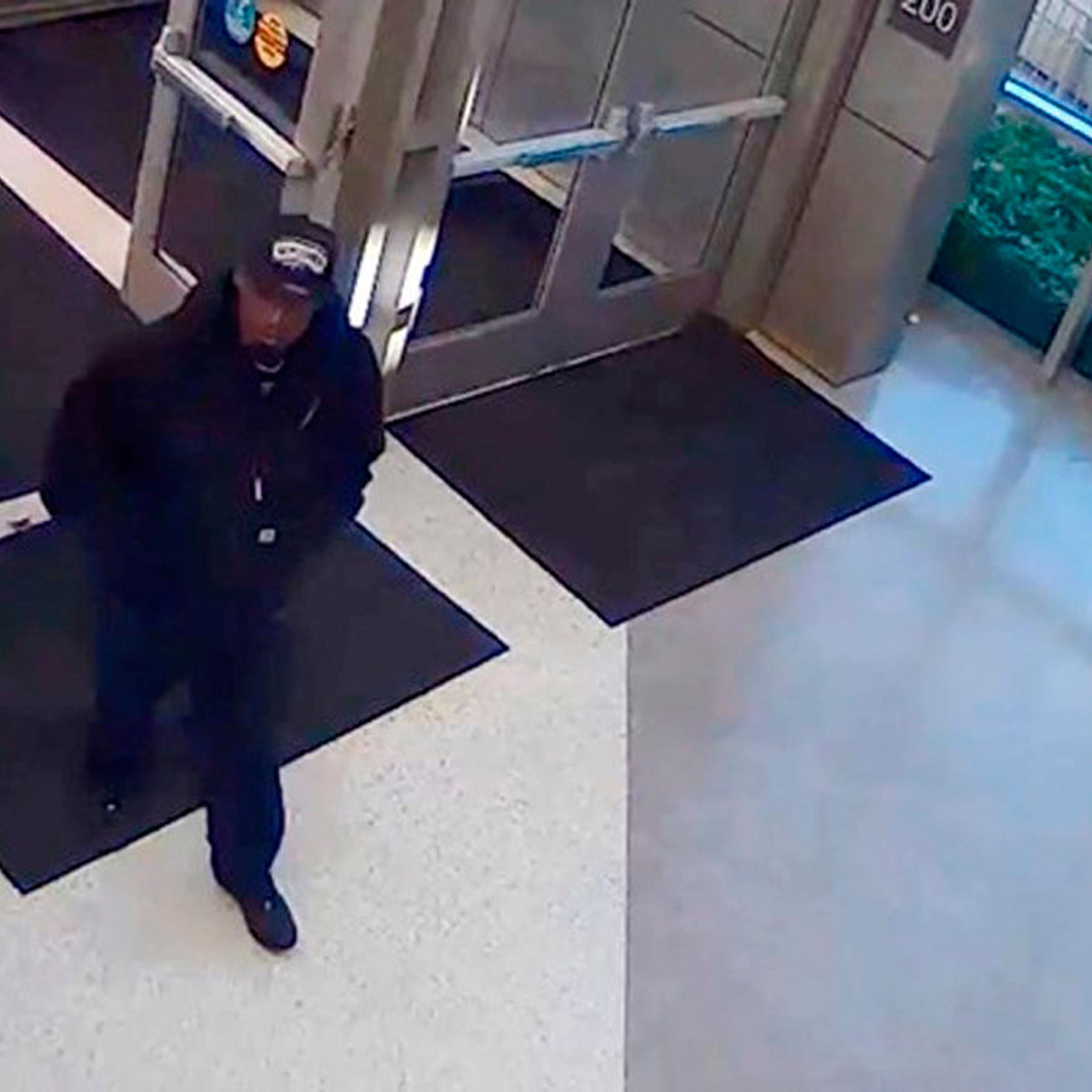 A man identified by the San Antonio Police Department as a suspect in the shooting death of police detective Benjamin Marconi, 50, is seen entering the police headquarters building in San Antonio, Texas, November 20, 2016, in a frame grab from video rele