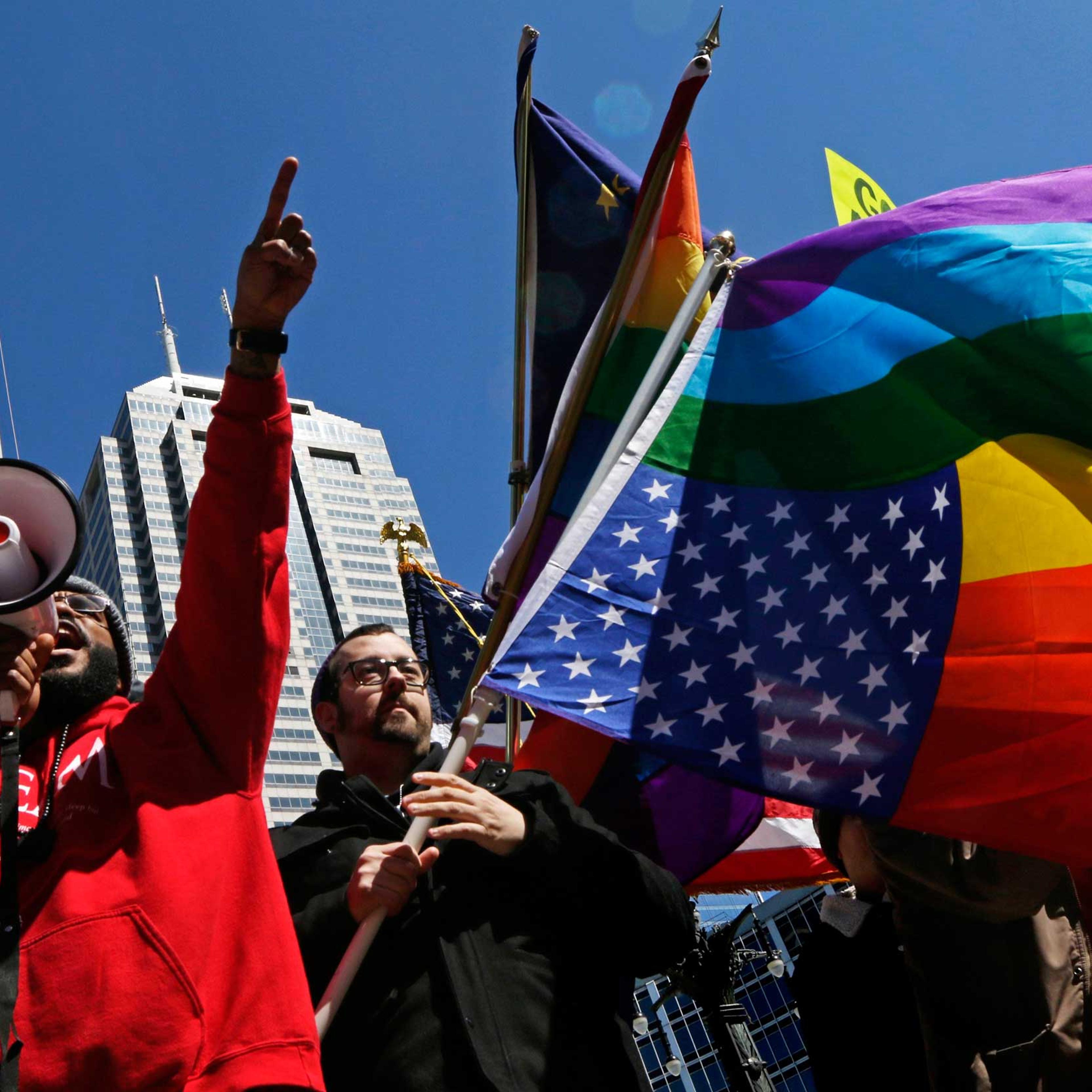 Organizers fire up a crowd of demonstrators gathered to protest a controversial religious freedom bill recently signed by Governor Mike Pence, in Indianapolis March 28, 2015.