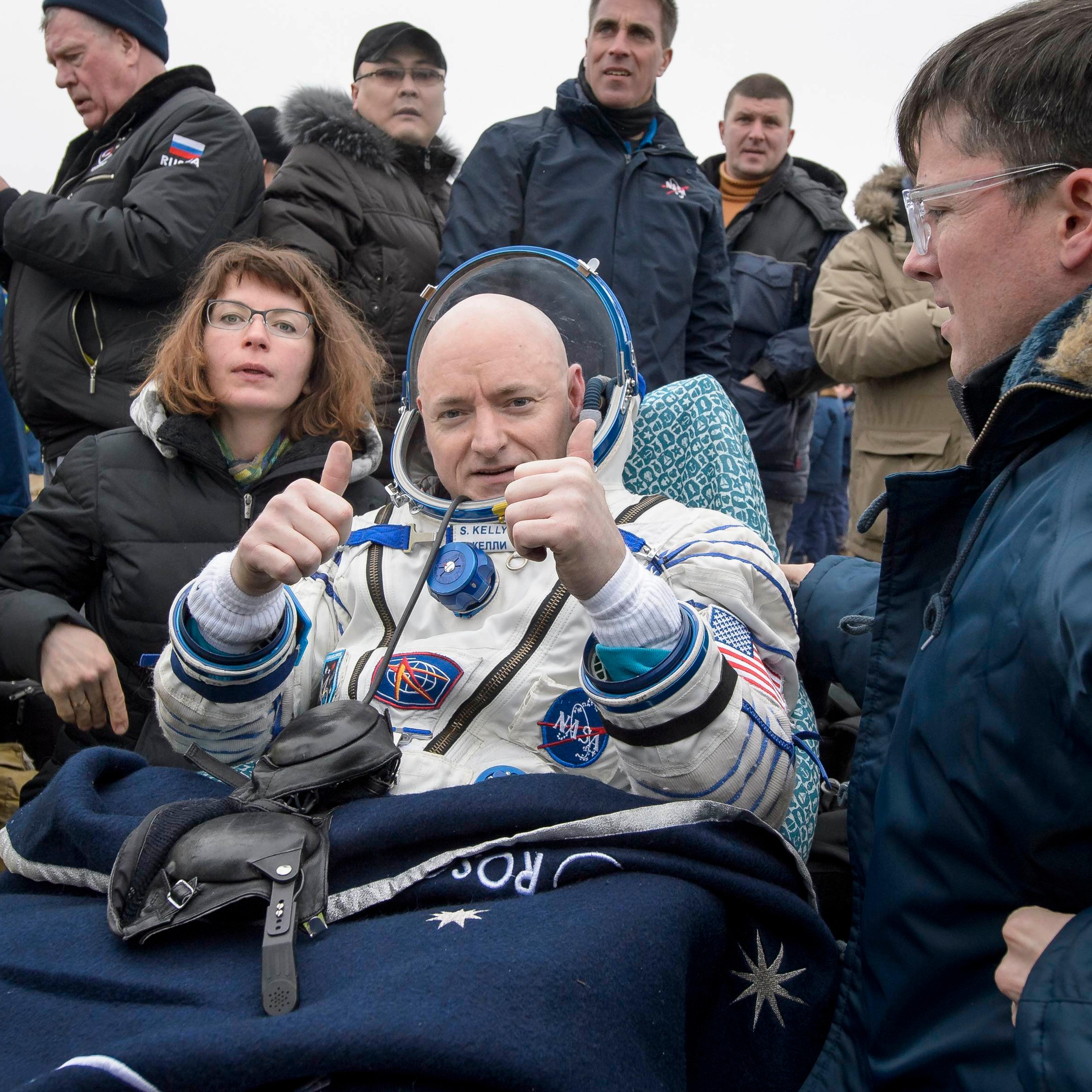 Expedition 46 Commander Scott Kelly of NASA rest in a chair outside of the Soyuz TMA-18M spacecraft near the town of Zhezkazgan Kazakhstan