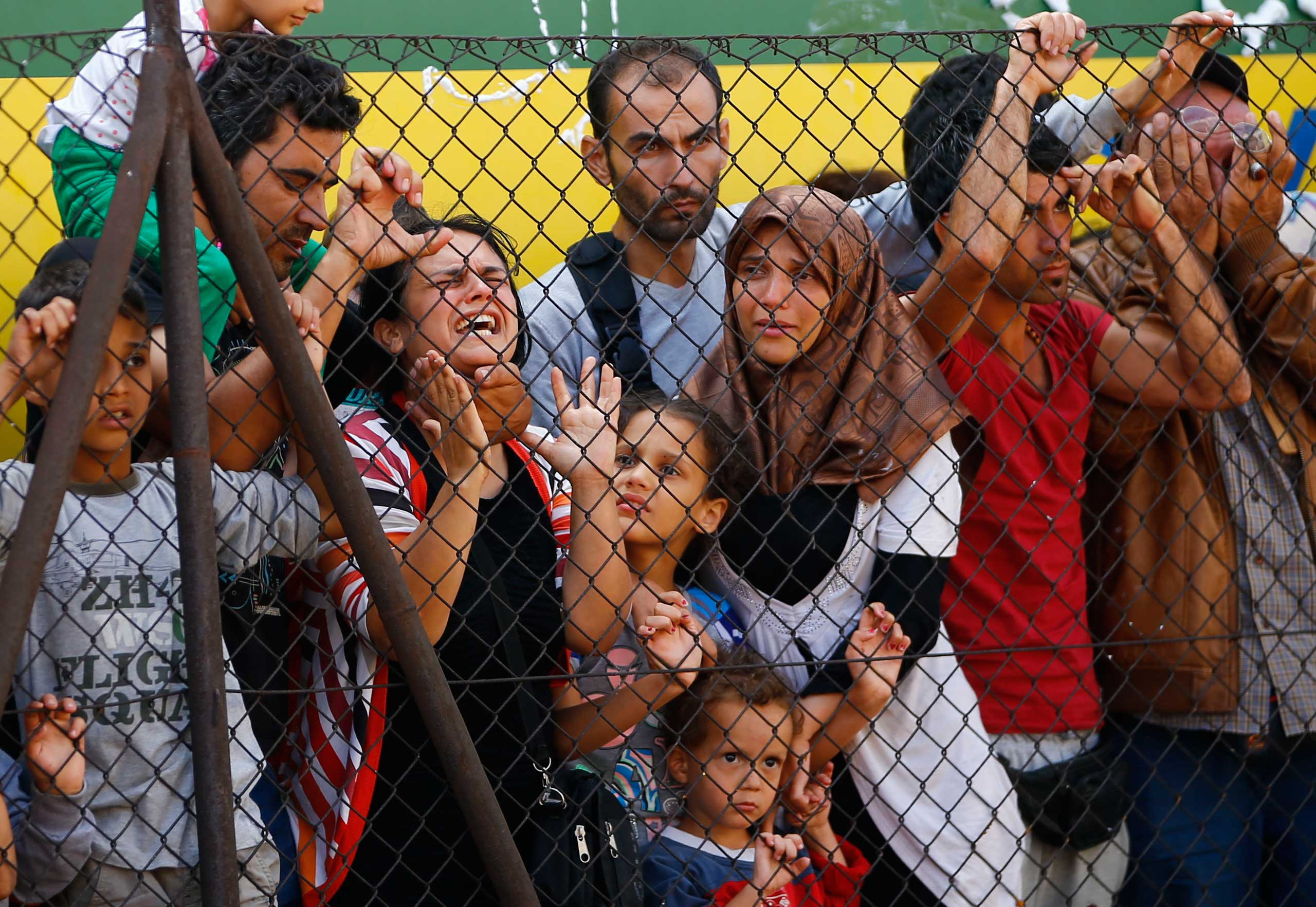 Migrants protest in front of the Bicske railway station in Bicske