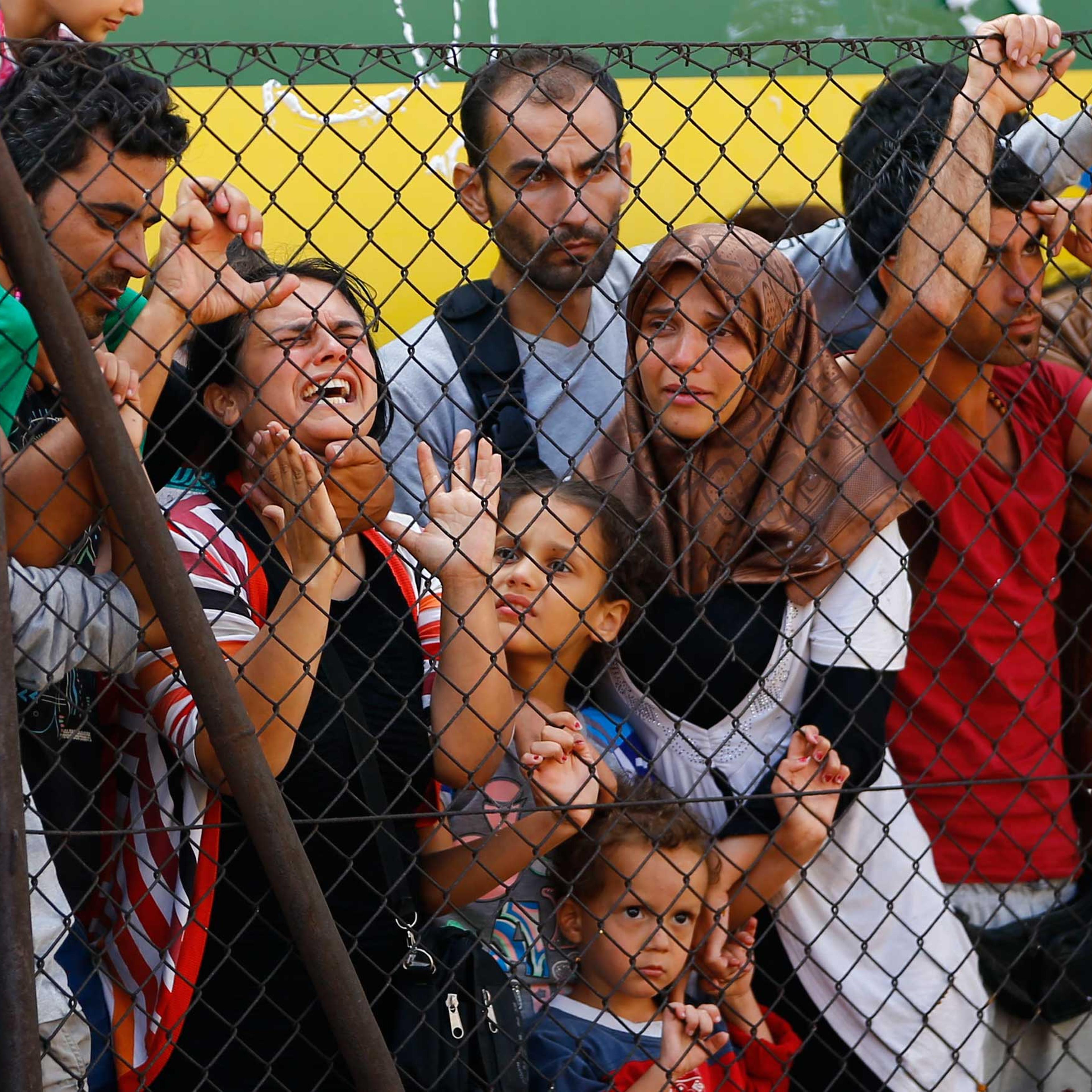 Migrants protest in front of the Bicske railway station in Bicske