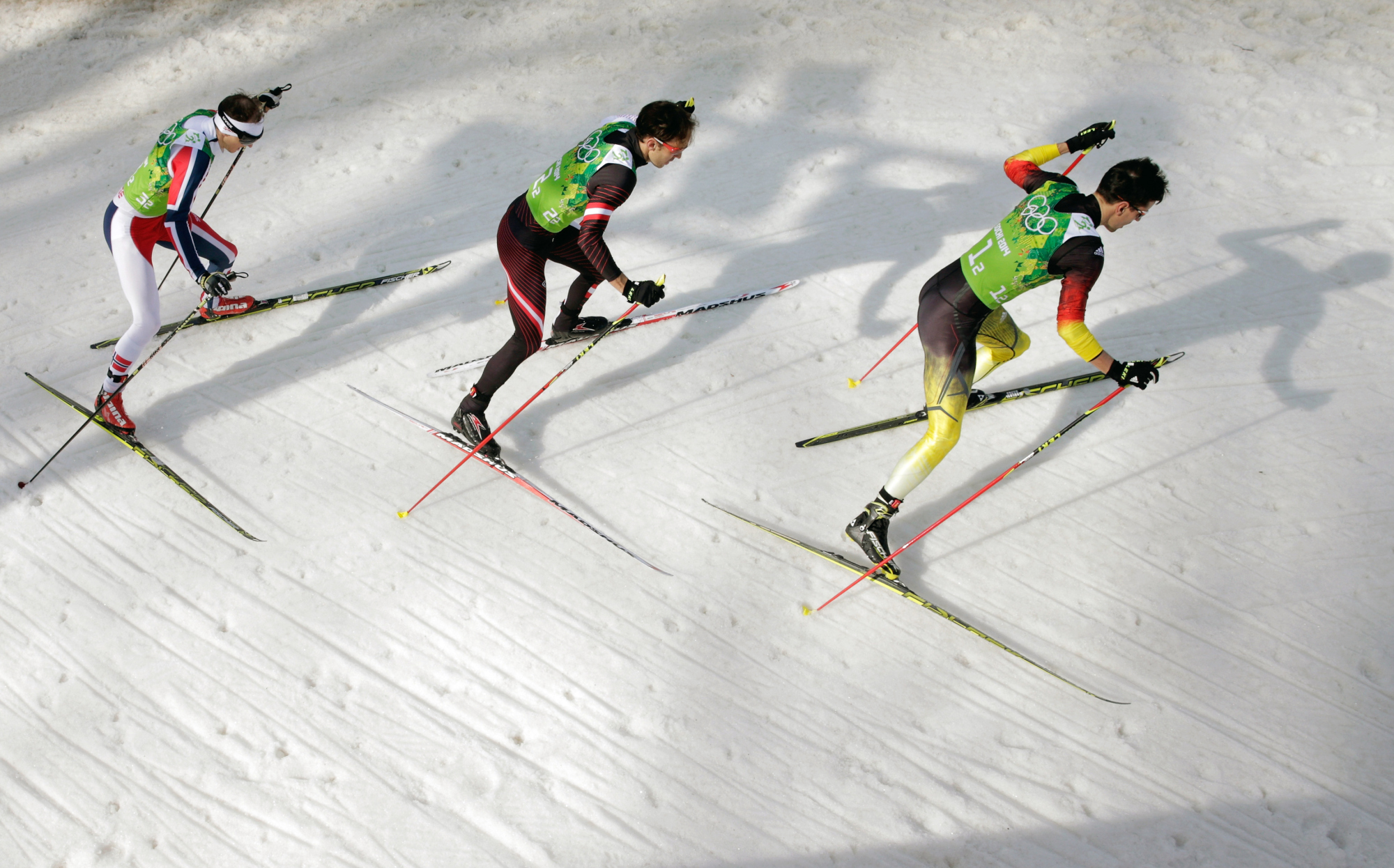 Haavard Klemetsen of Norway, Christoph Bieler of Austria and Bjoern Kircheisen of Germany compete in the Nordic Combined Men's Team 4 x 5 km.