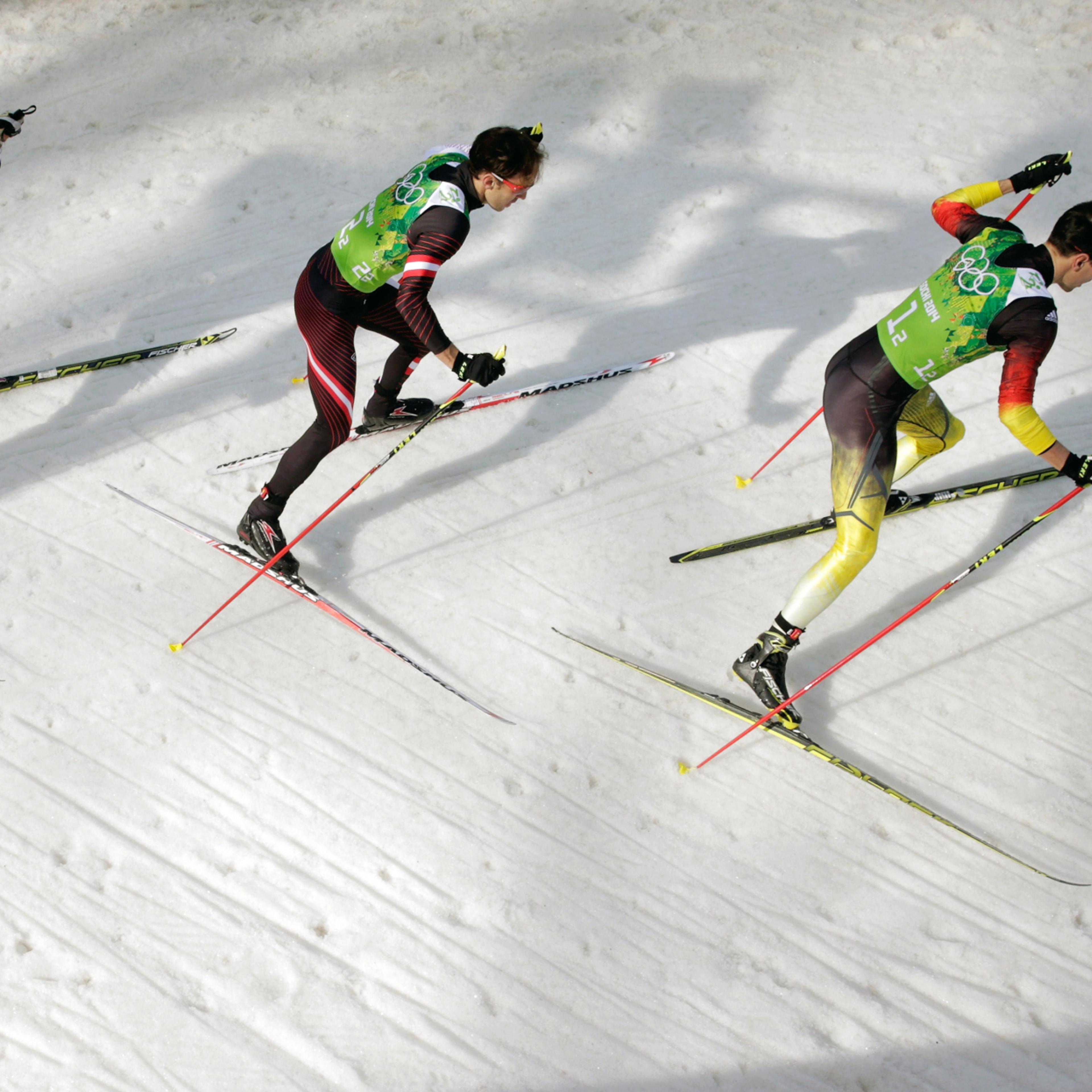 Haavard Klemetsen of Norway, Christoph Bieler of Austria and Bjoern Kircheisen of Germany compete in the Nordic Combined Men's Team 4 x 5 km.