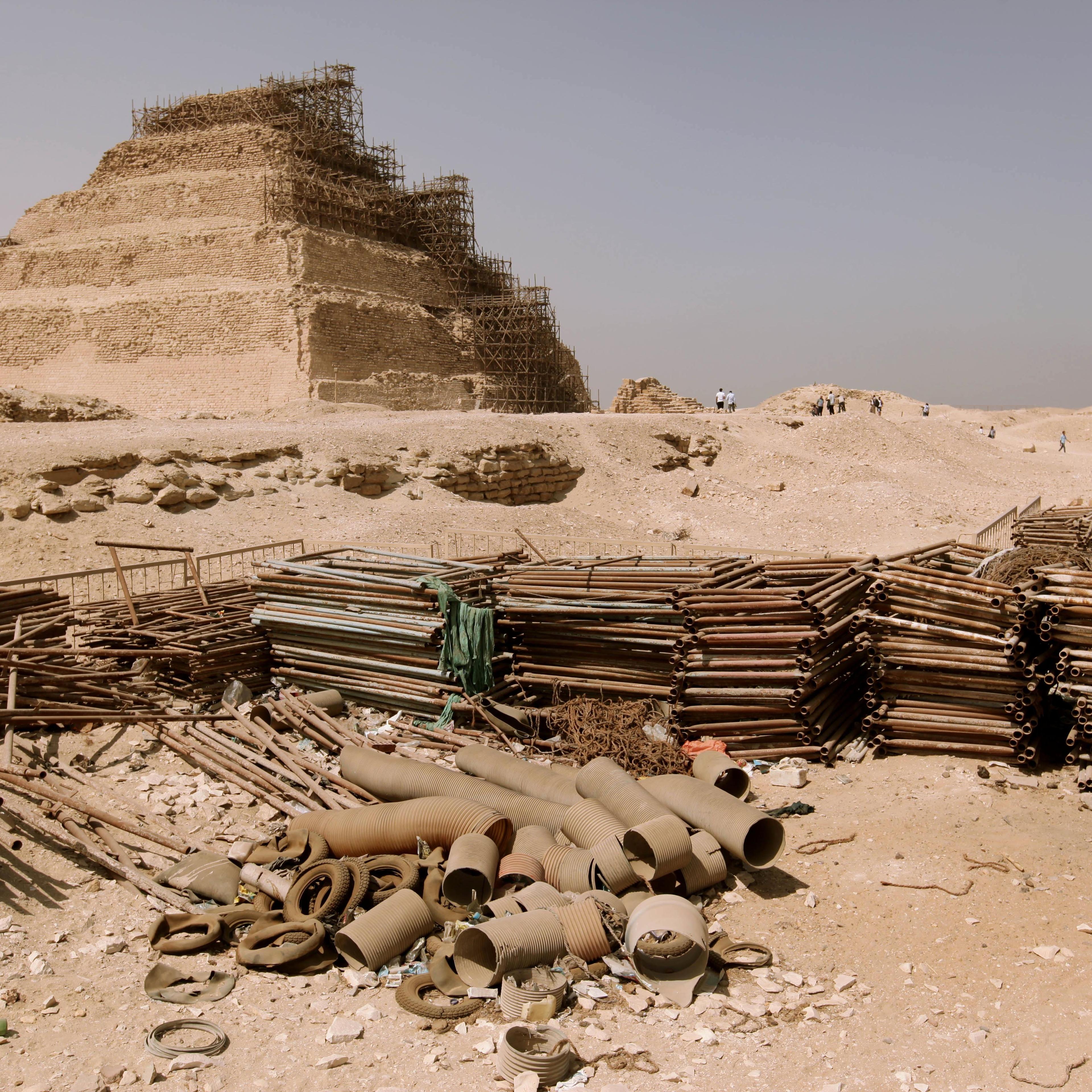 Building materials gather dust at the foot of the Djoser Pyramid in Saqqara, Egypt on Sept. 16, 2014.