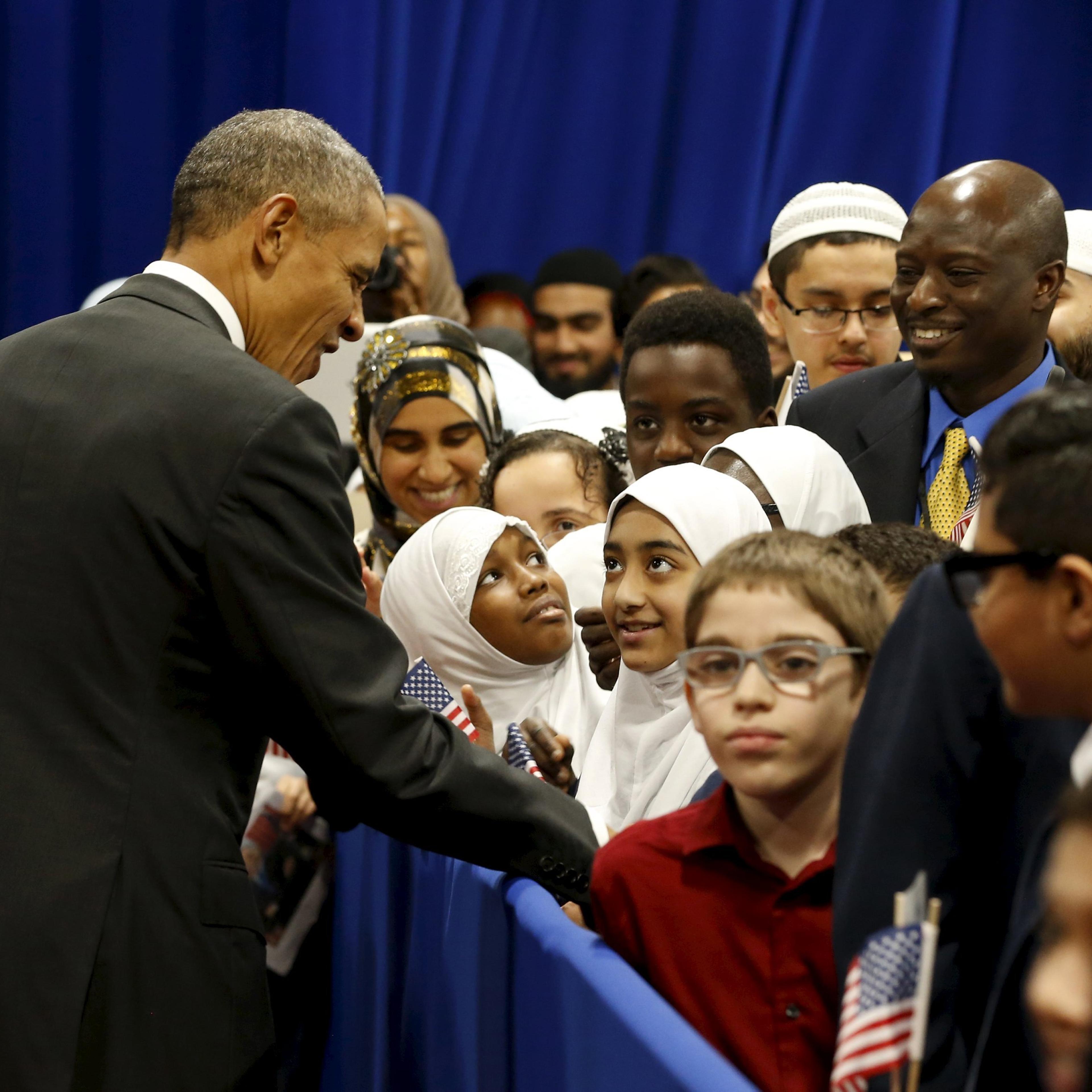 Obama greets students after his remarks at the Islamic Society of Baltimore mosque in Catonsville, Maryland