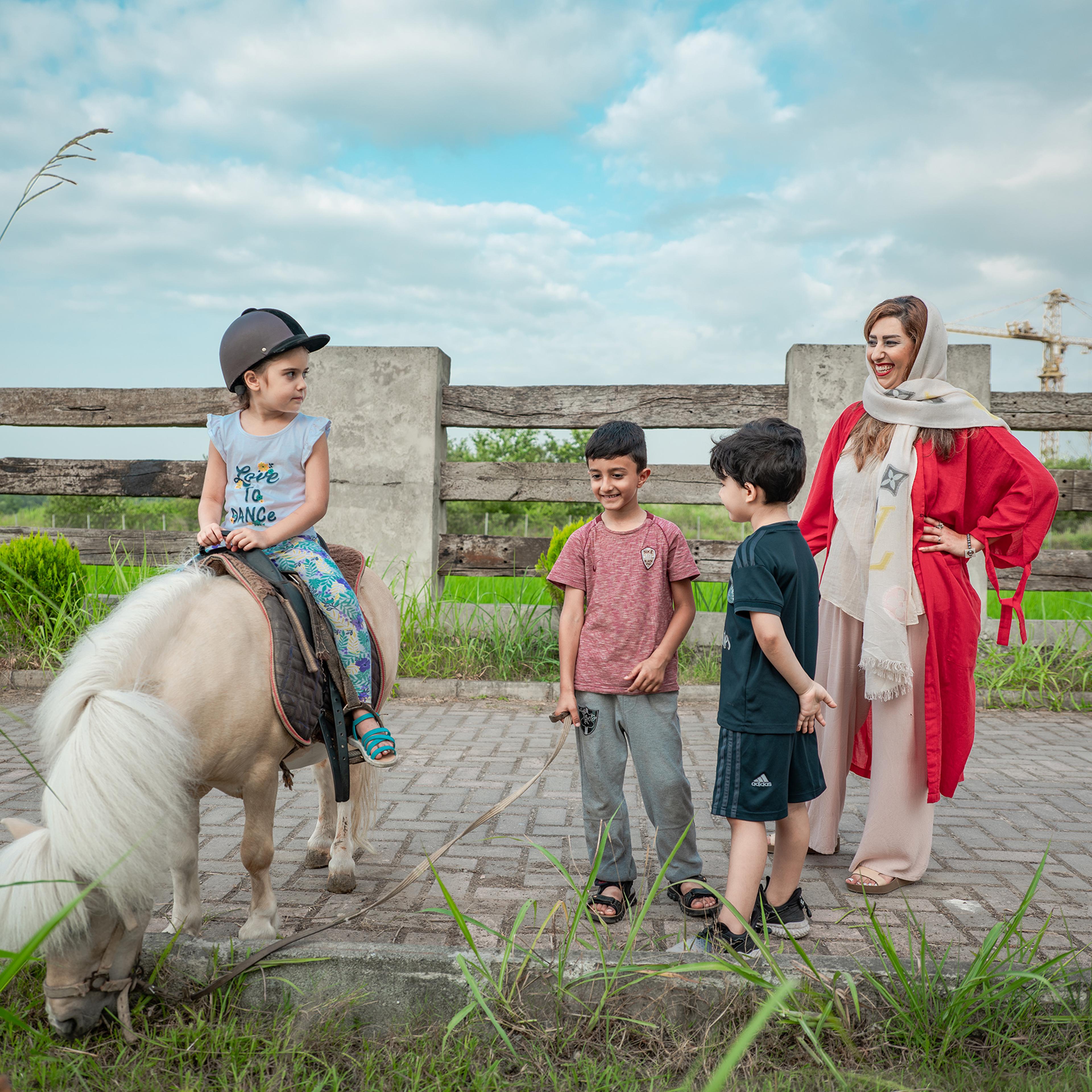 An Iranian girl rides on a young Caspian horse in Dashte-Noor, a private village near the Caspian sea in Iran, on June 18, 2020.
