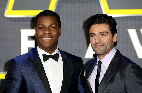 John Boyega and Oscar Isaac attend the European Premiere of 'Star Wars: The Force Awakens' at Leicester Square on December 16, 2015 in London, England.