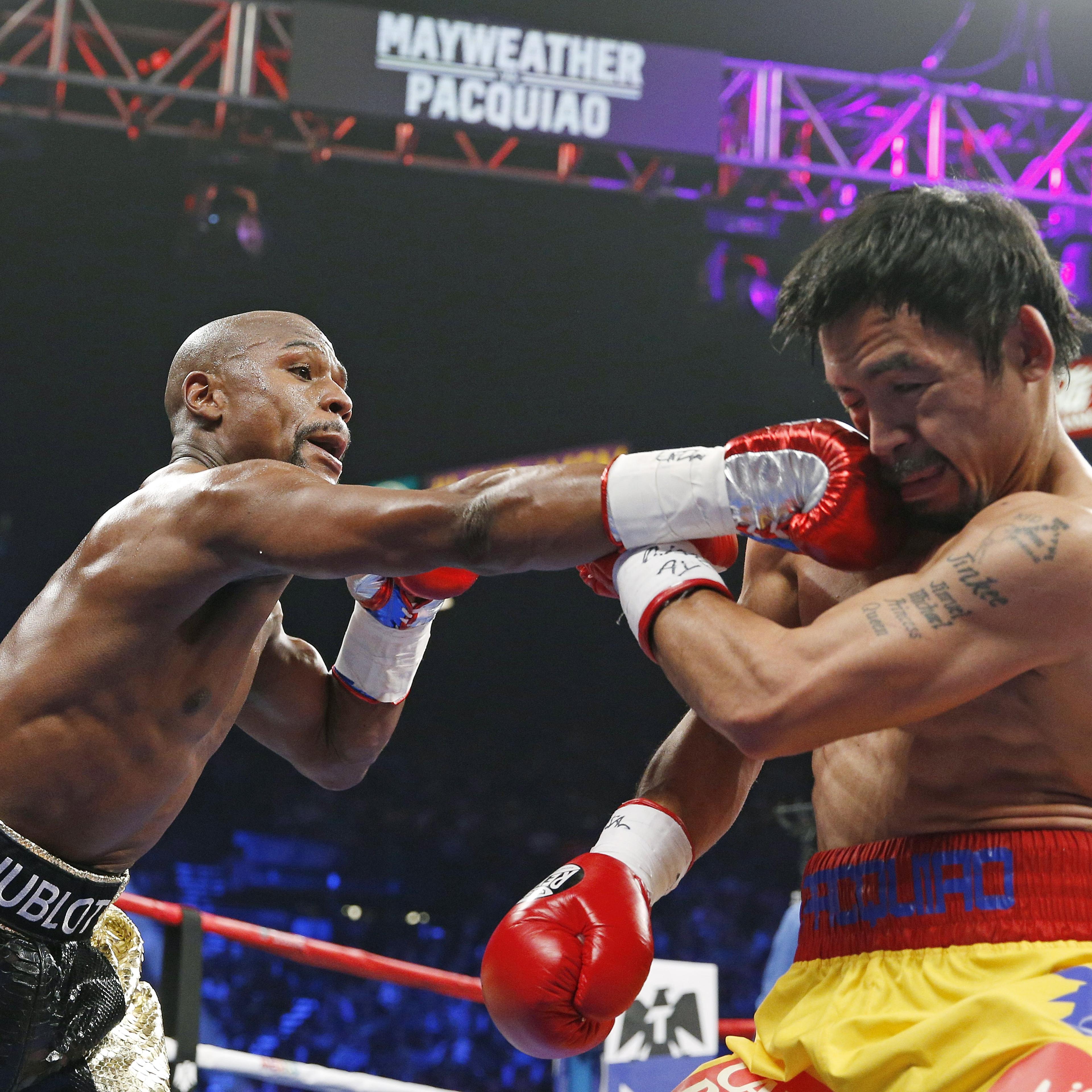Floyd Mayweather Jr., left, connects with a right to the head of Manny Pacquiao, from the Philippines, on May 2, 2015 in Las Vegas