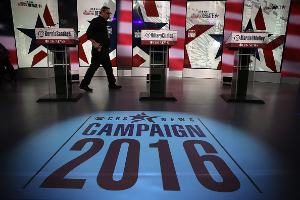 A crewmember walks on the stage prior to a Democratic presidential debate sponsored by CBS at Drake University on November 14, 2015 in Des Moines, Iowa.