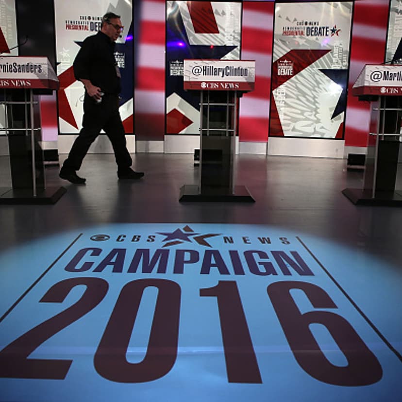 A crewmember walks on the stage prior to a Democratic presidential debate sponsored by CBS at Drake University on November 14, 2015 in Des Moines, Iowa.