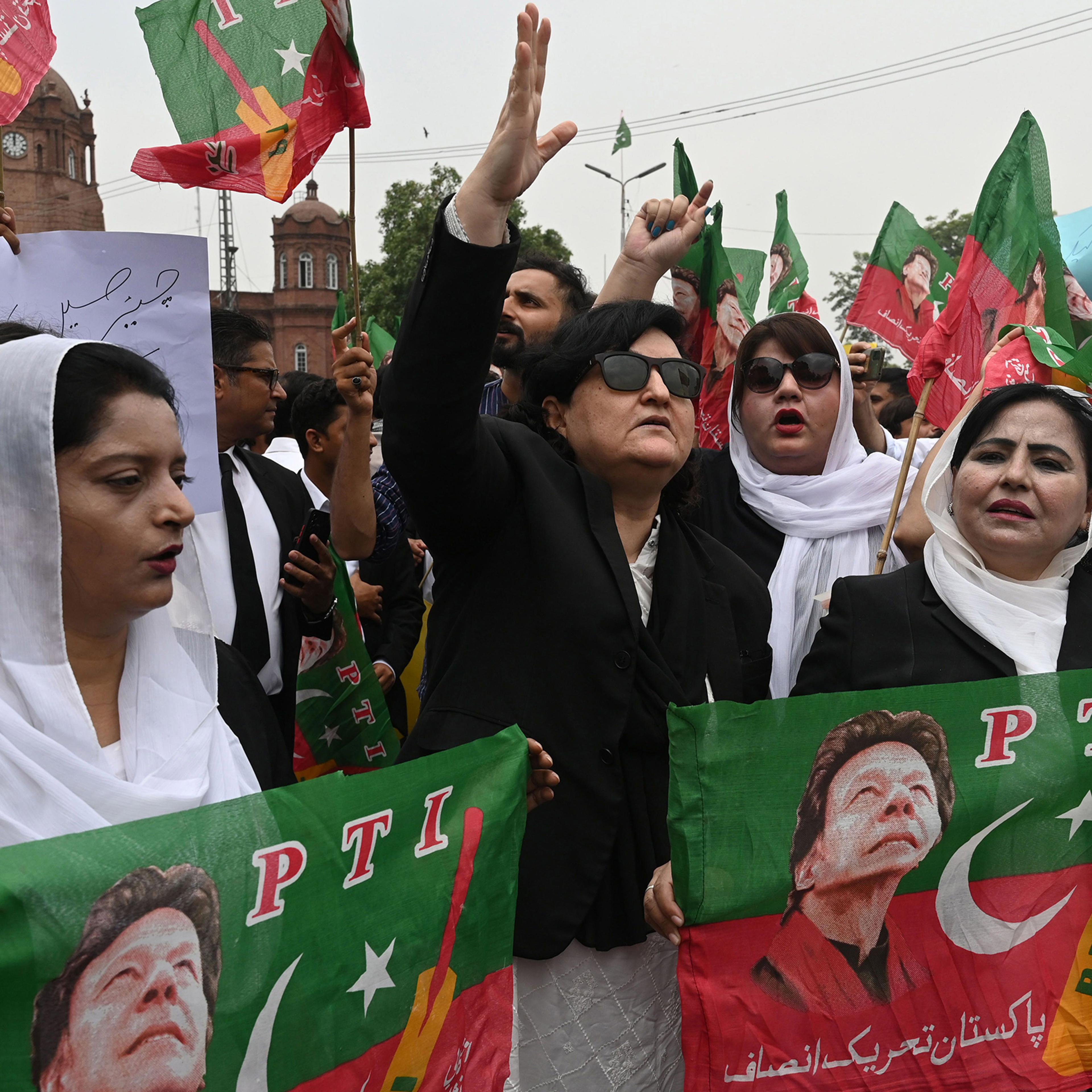 Supporters of the Pakistan Tehrik-i-Insaf (PTI) party gather in protest after former Pakistani Prime Minister Imran Khan's arrest, outside the High court in Lahore, Pakistan, on Aug. 7.