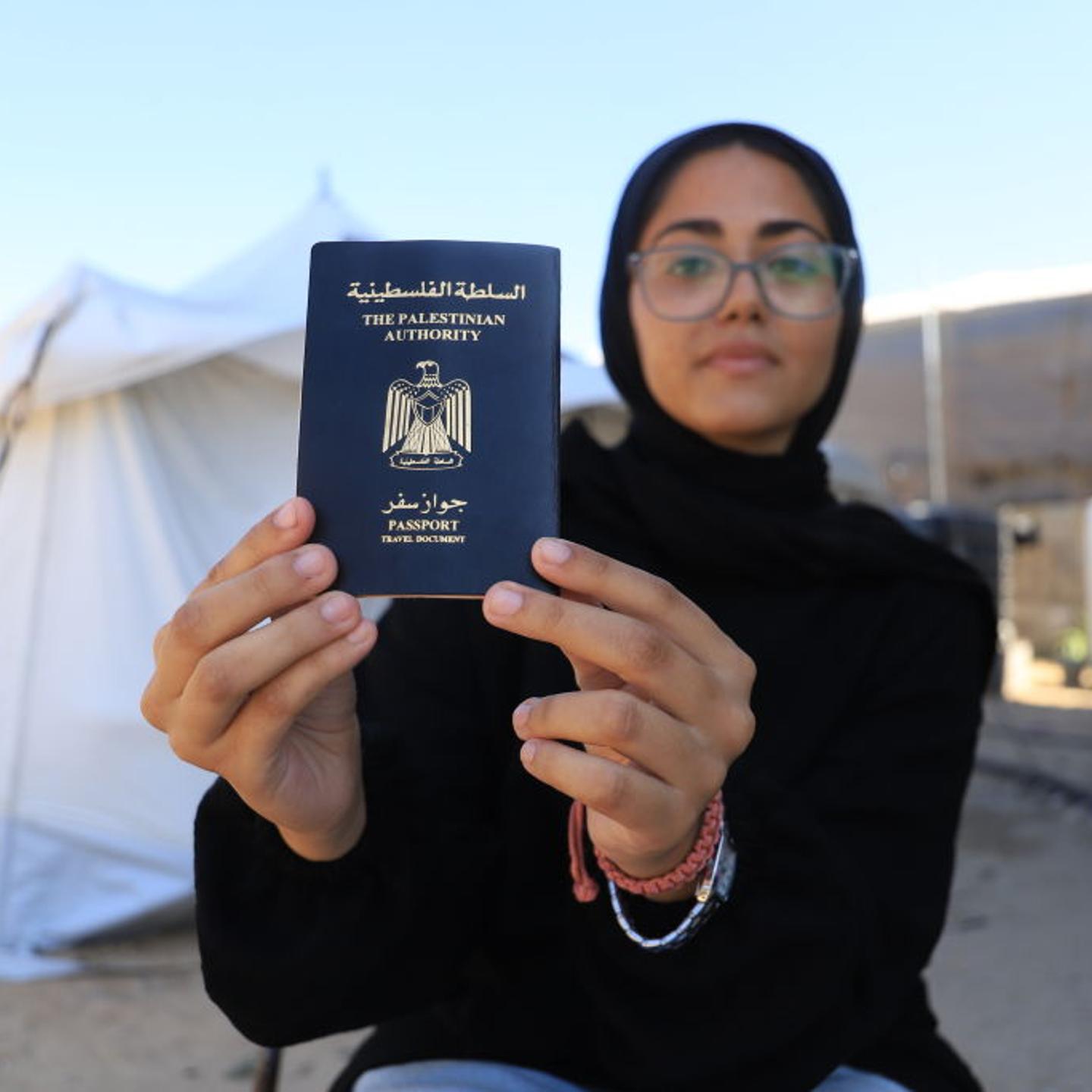 Palestinian girl holding her passport